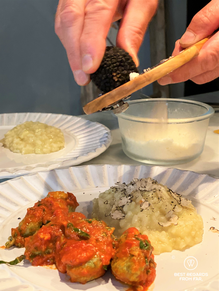 White plates with gnudis and a truffle risotto