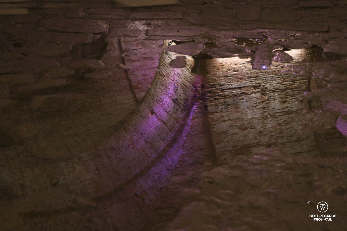 Reflections of the brick vaults underneath the city walls in Lucca