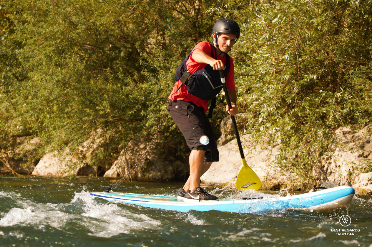 Stand Up Paddling the white waters of the Serchio River by Lucca, Italy.