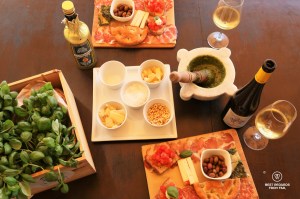Tasting the pesto with bites and local wine after the pesto workshop at Nessun Dorma in Cinque Terre, Italy