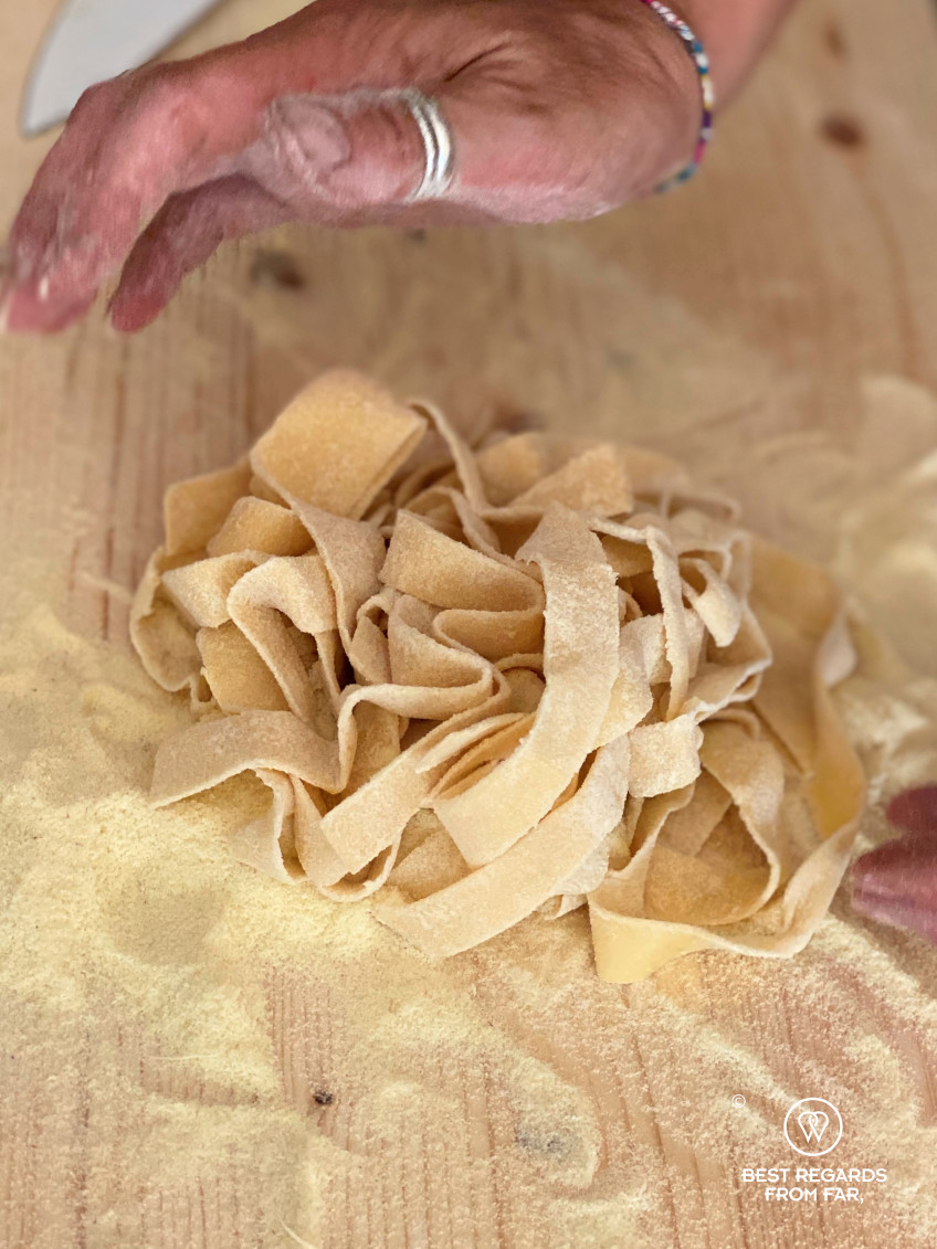 Semola being added to freshly made tagliatelle