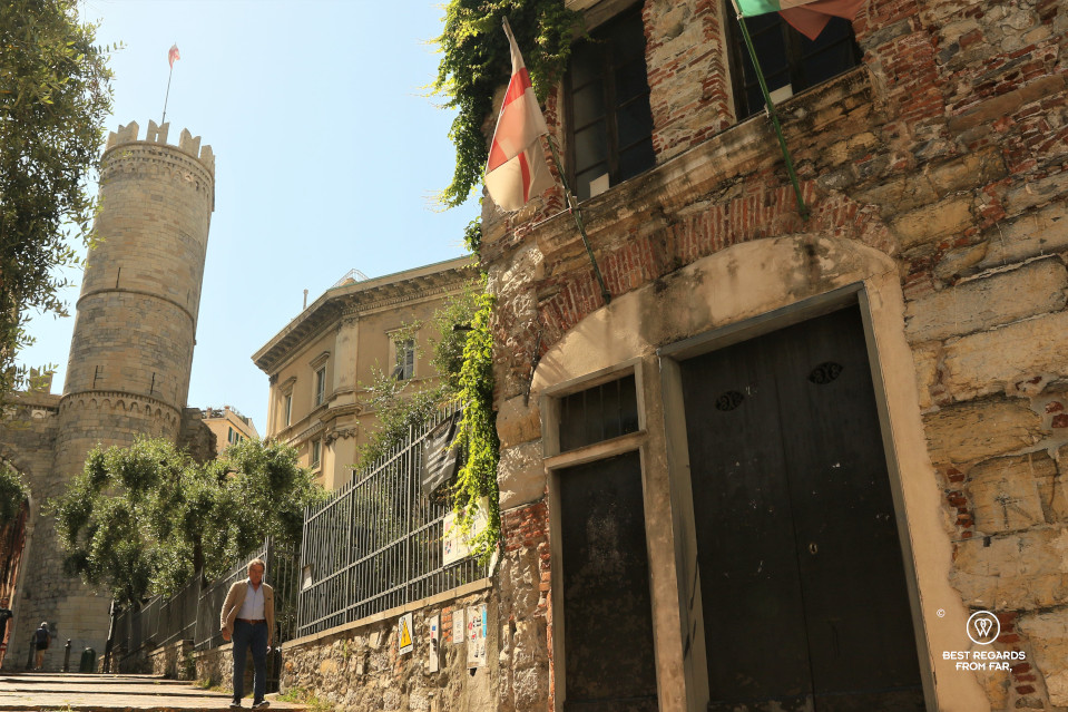 Chirstopher Columbus' birth house with a medieval tower at the background in Genoa