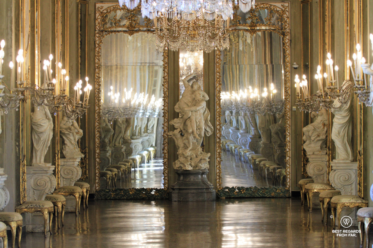 Room with sculptures, lamps and mirrors in Italy