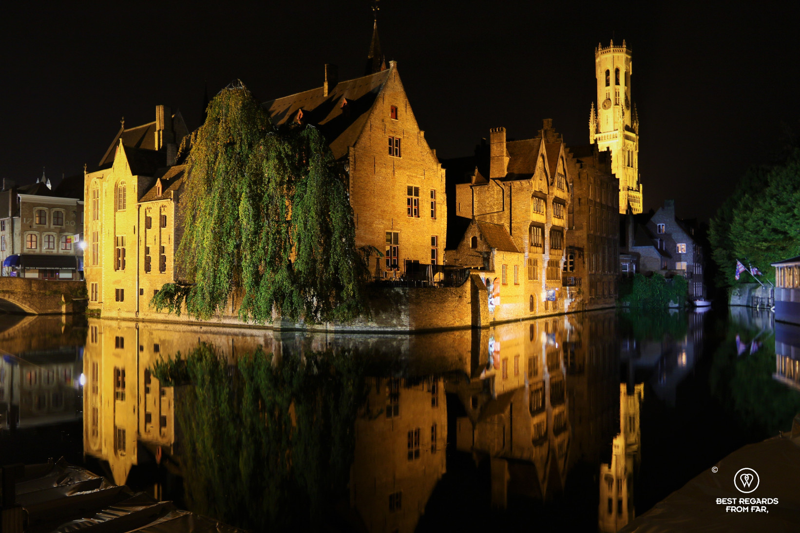 Reflections at the Dijver at night in Bruges, Belgium
