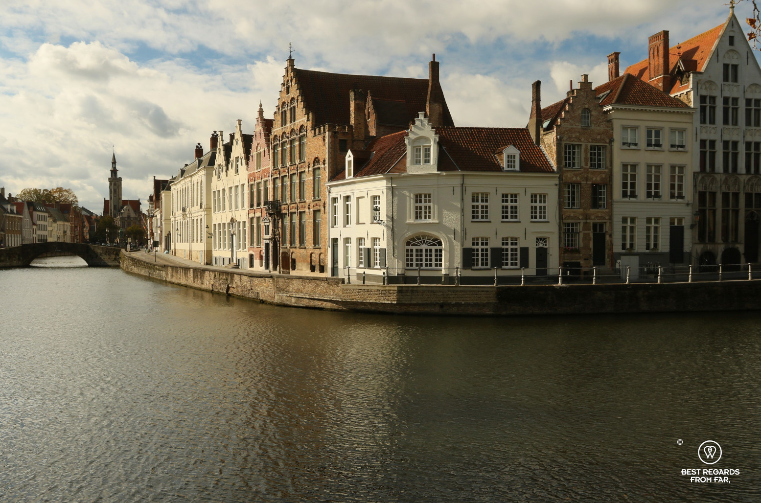 Waterway with cute houses lined up in Bruges, Belgium