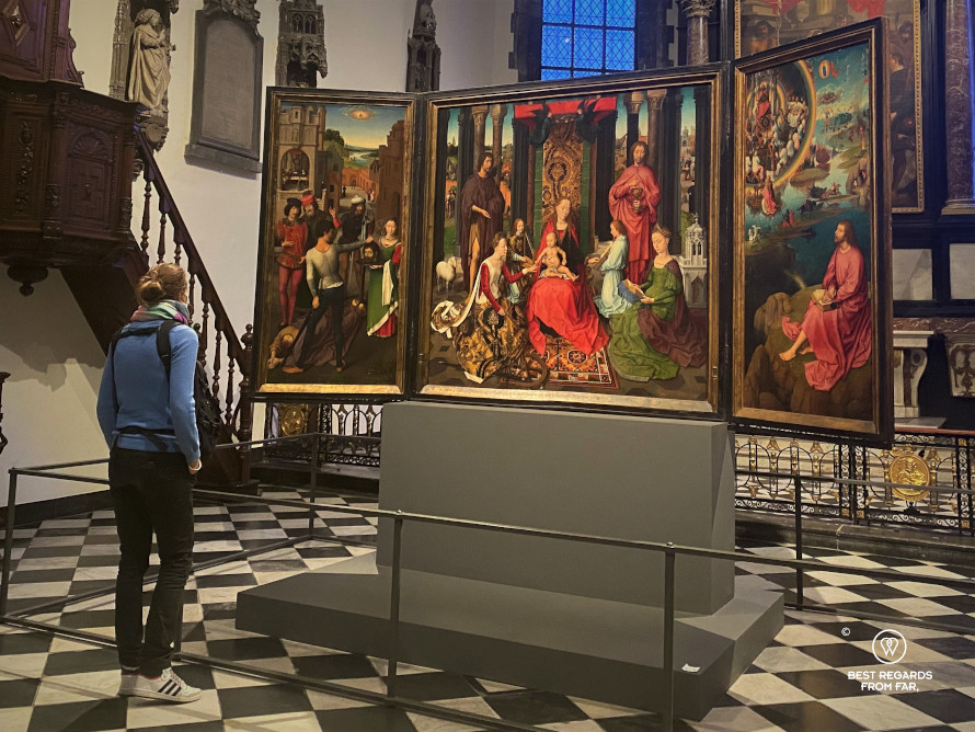 Admiring the Triptych by Hans Memling in the Saint John's Hospital, Bruges, Belgium