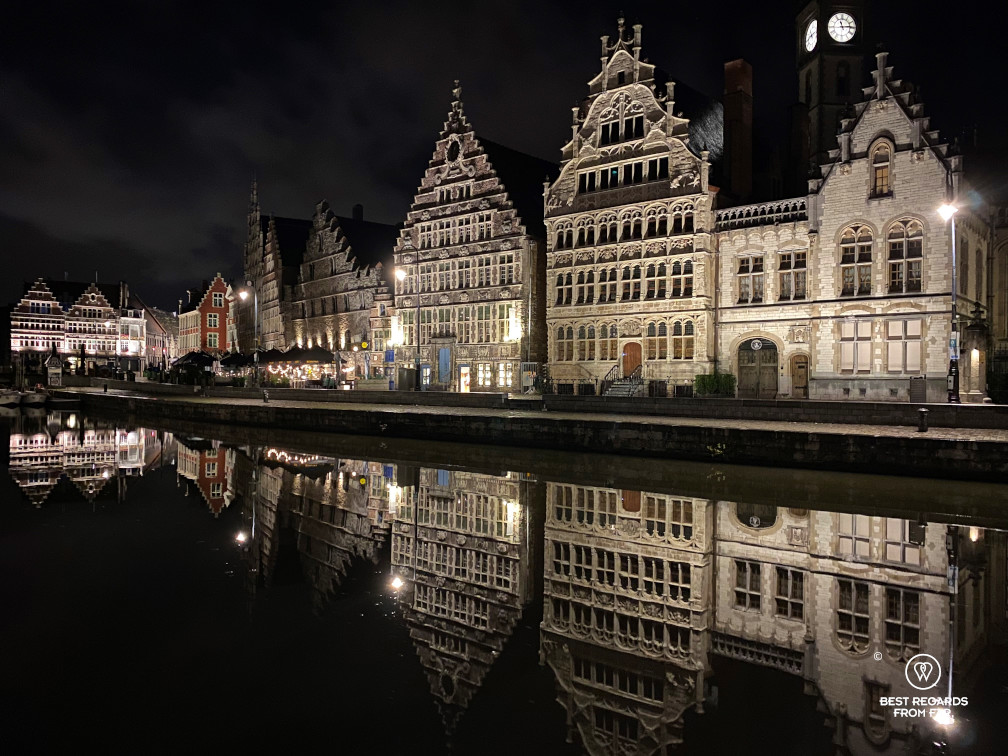 Reflections of medieval buildings in the Lys River along the Graslei in Ghent, Belgium
