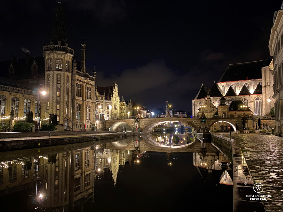 Reflections of medieval buildings in the Lys River along the Graslei in Ghent, Belgium