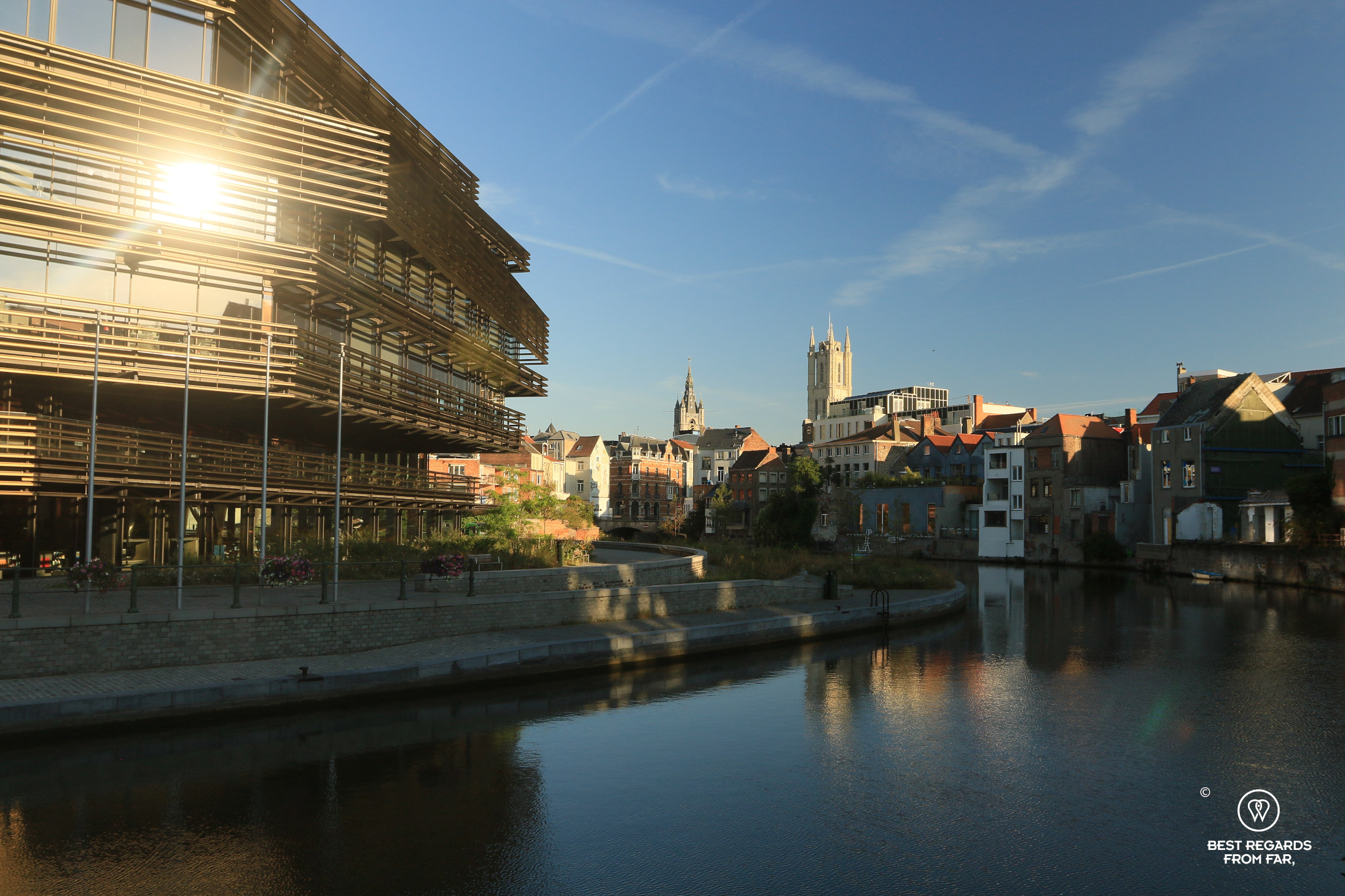 Modern buimding with reflections in the canals of Ghent, Belgium