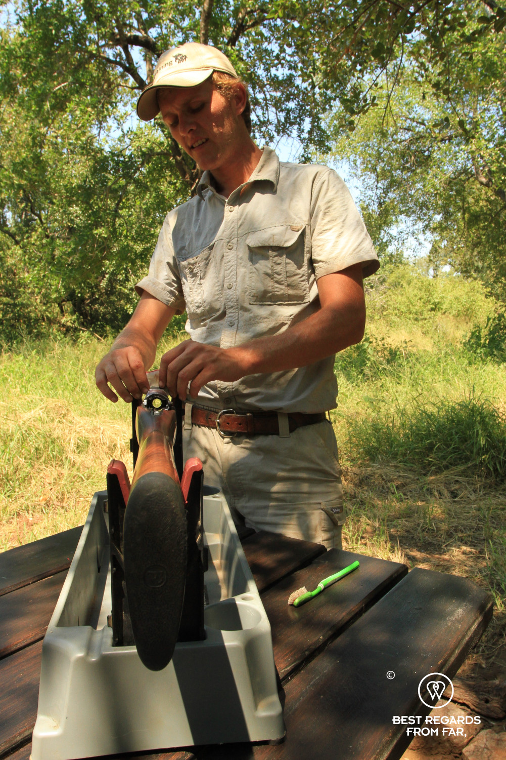 EcoTraining staff cleaning a riffle at camp