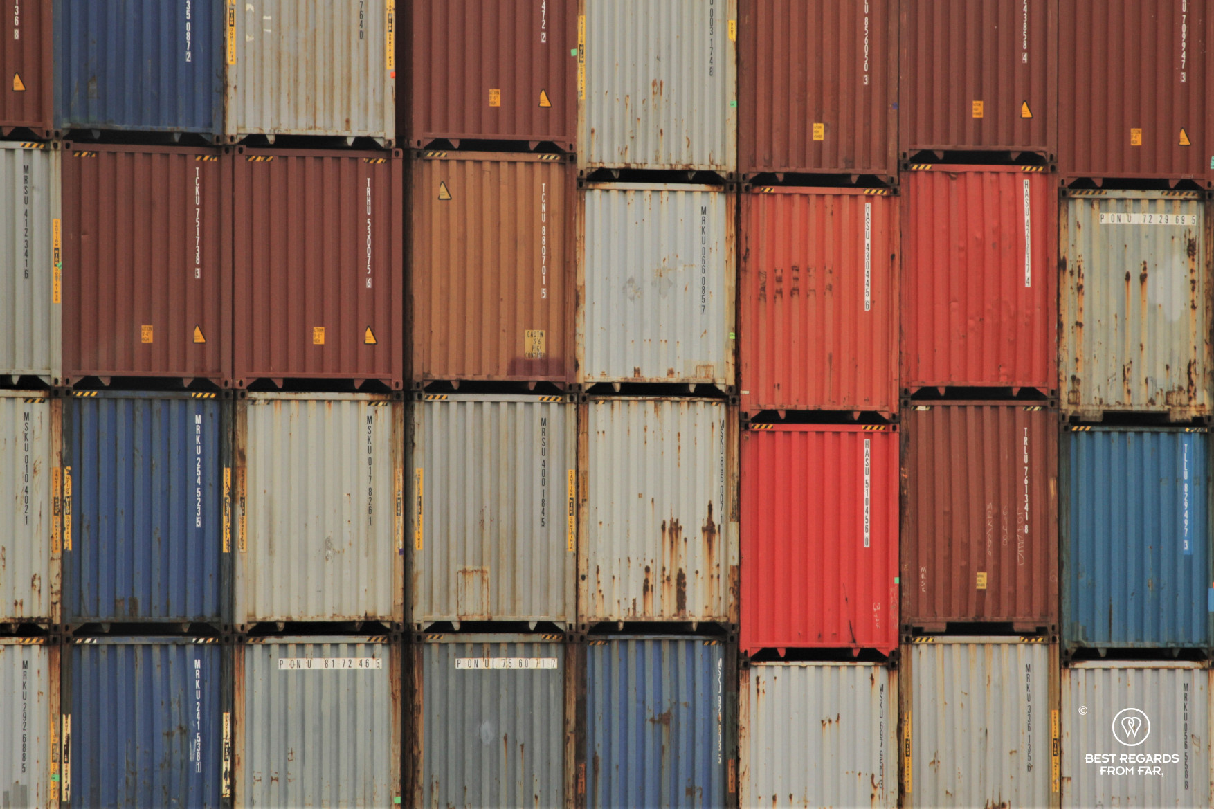 Colourful containers piled up in the industrial harbour of Antwerp, Belgium