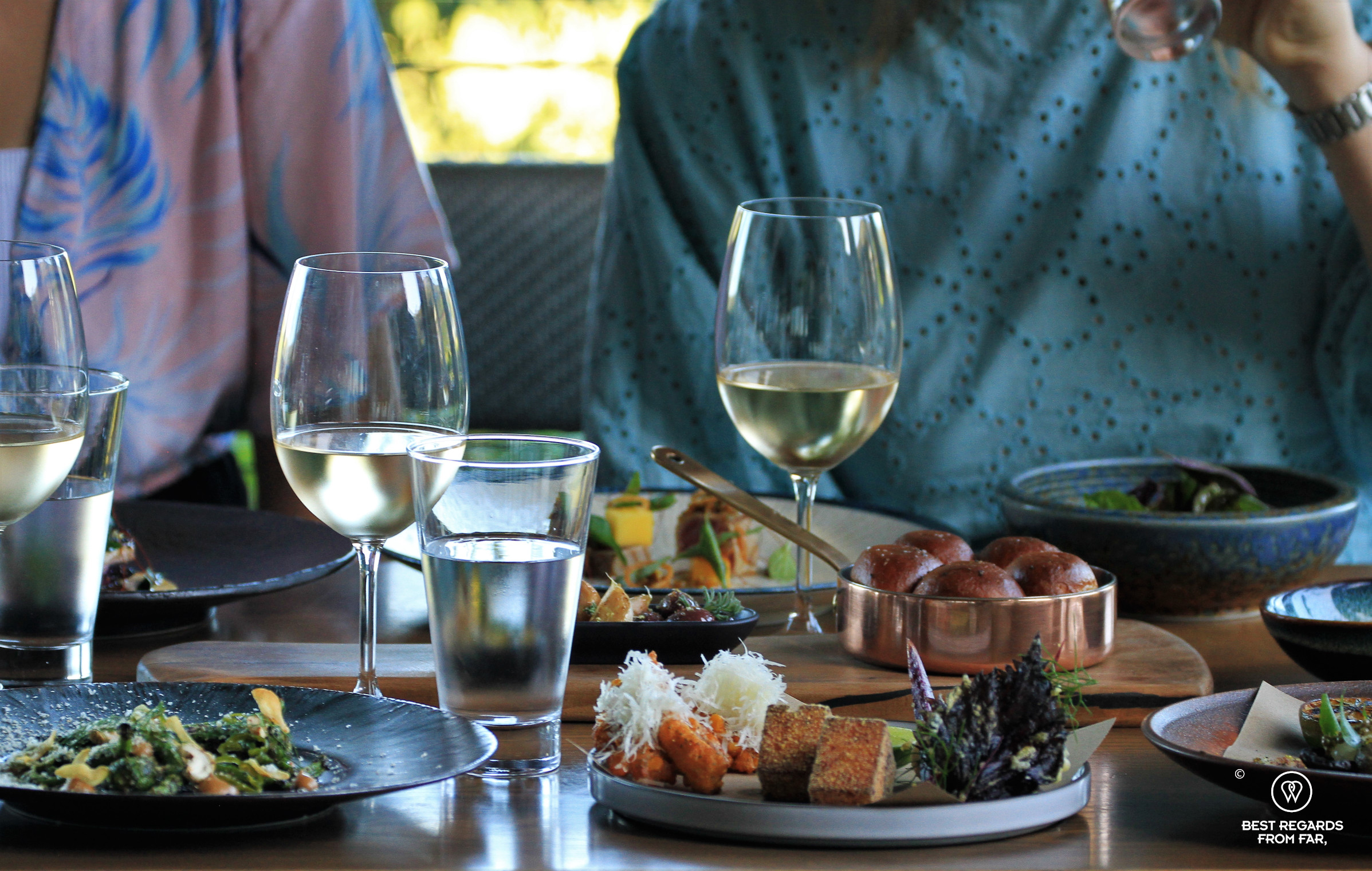 Guests seating for lunch and sharing tapas and wine at the Chefs Warehouse Beau Constantia