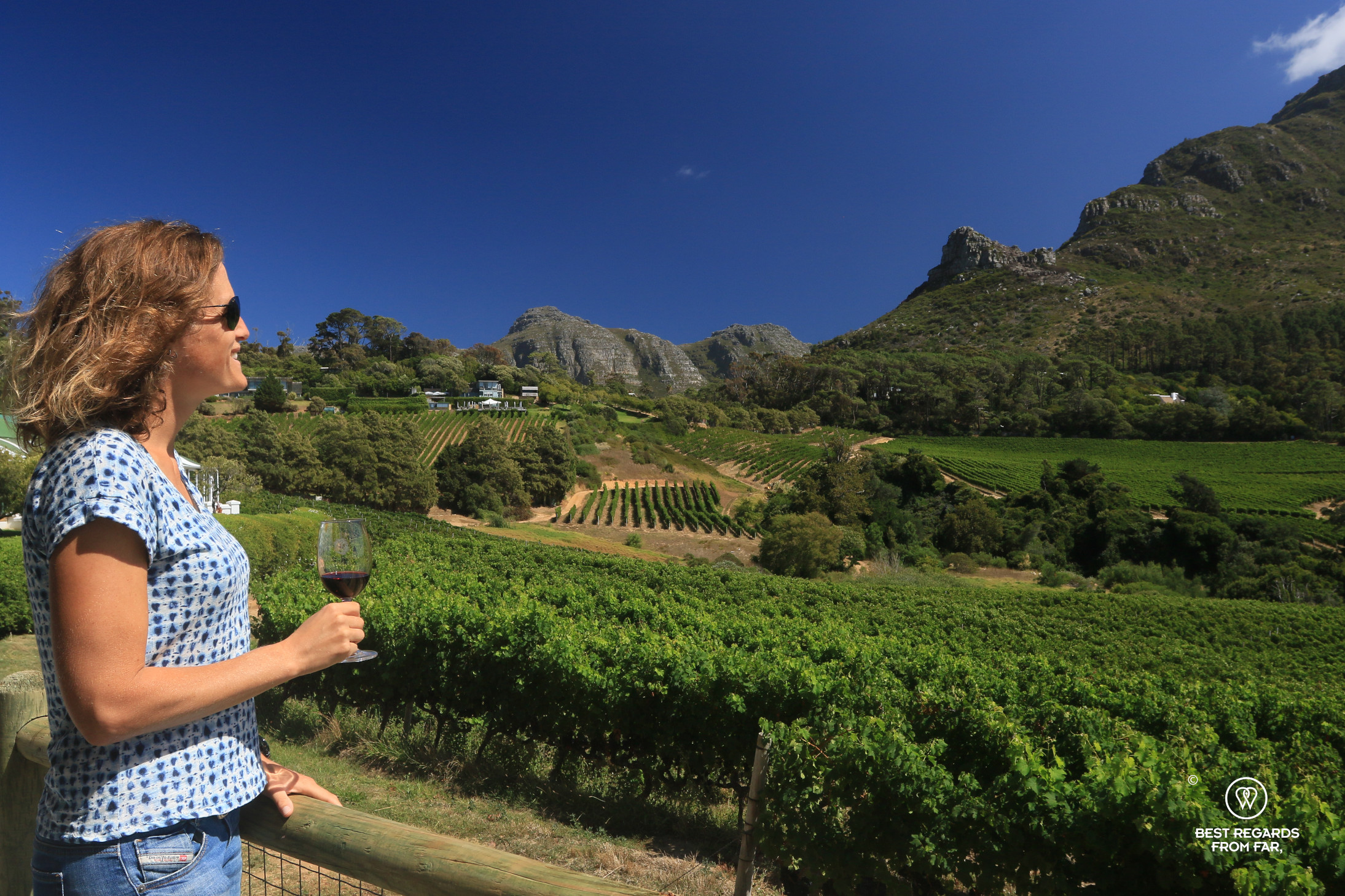 Author Marcella van Alphen enjoying a glass of Glen Constantia red wine overlooking the vineyard.
