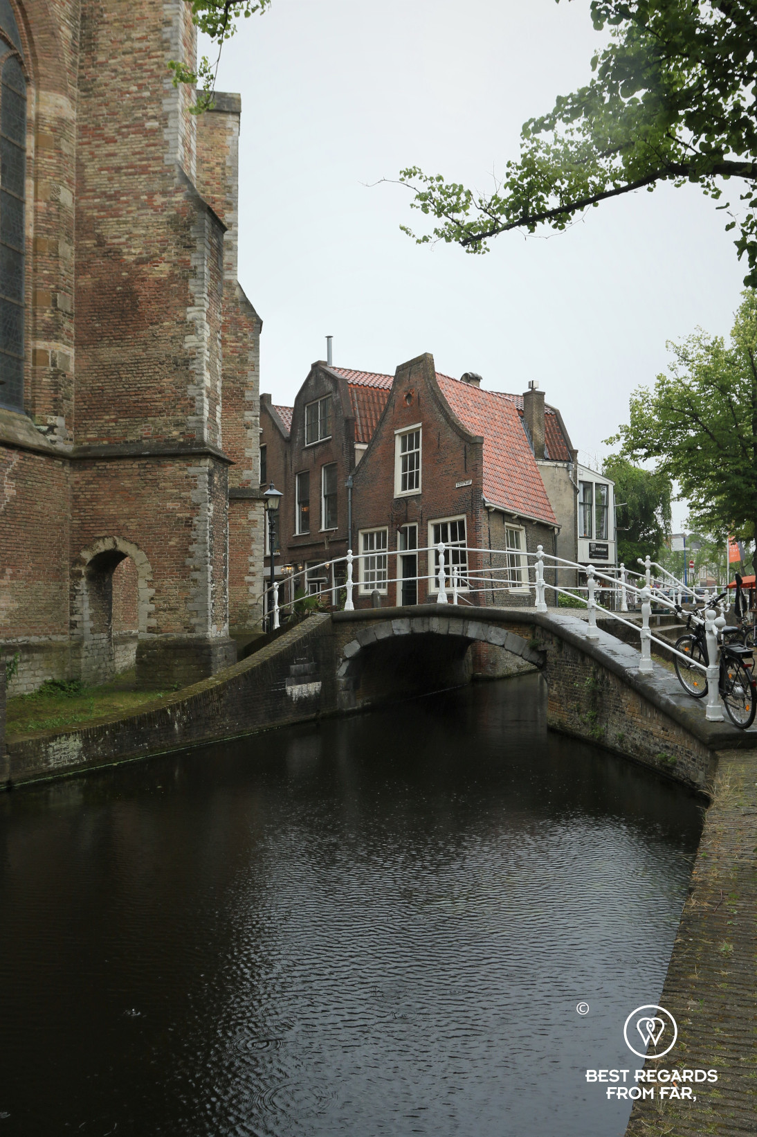 Old houses along a cute canal in Delft, The Netherlands
