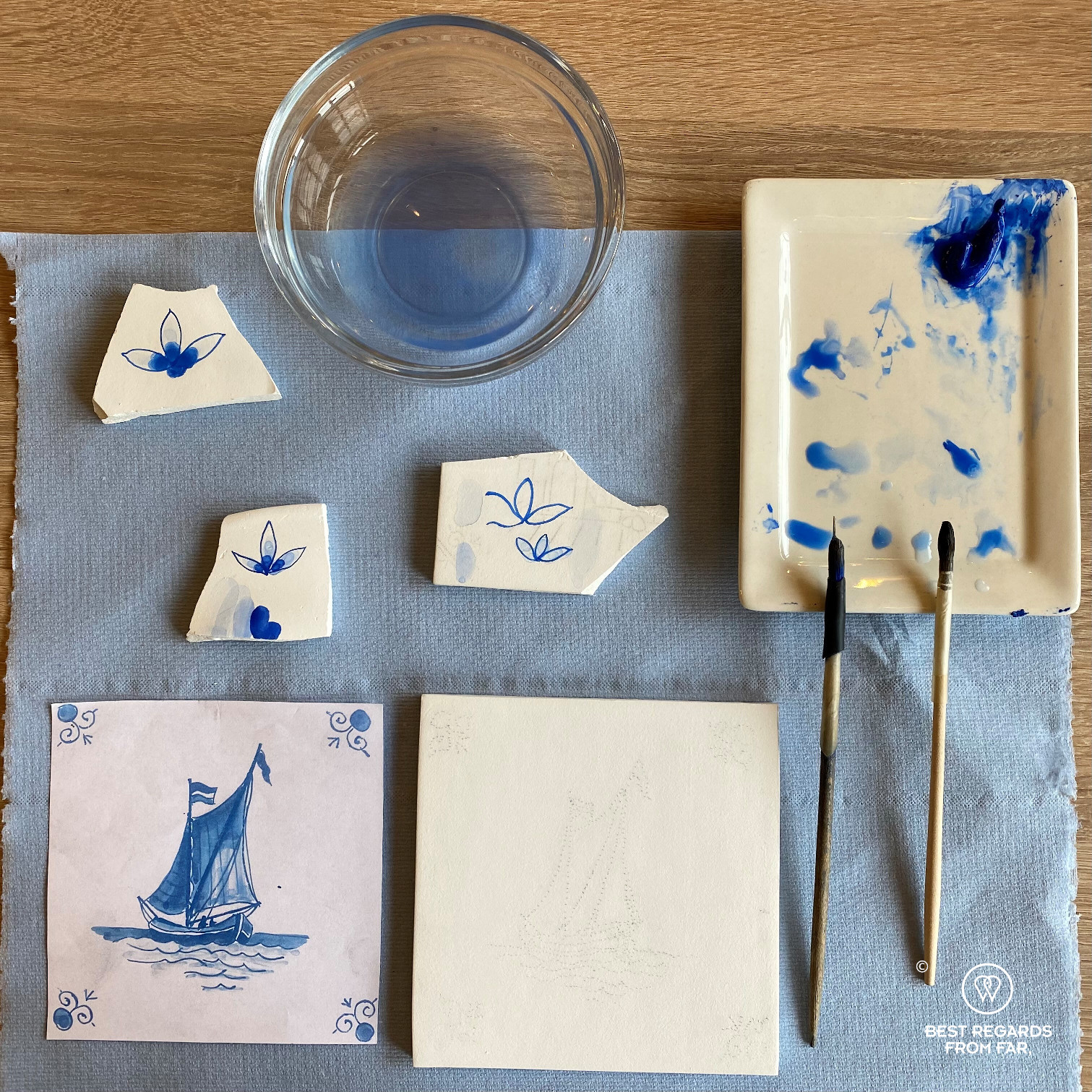 Contours of the motif of a sailboat on a tile during a tile painting workshop at Royal Delft, the Netherlands