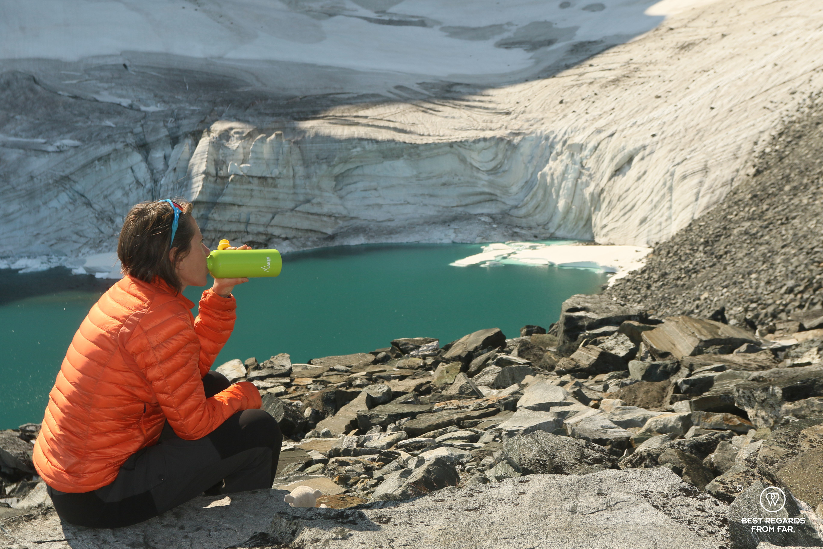 Author Claire Lessiau taking a break at a glacier lake