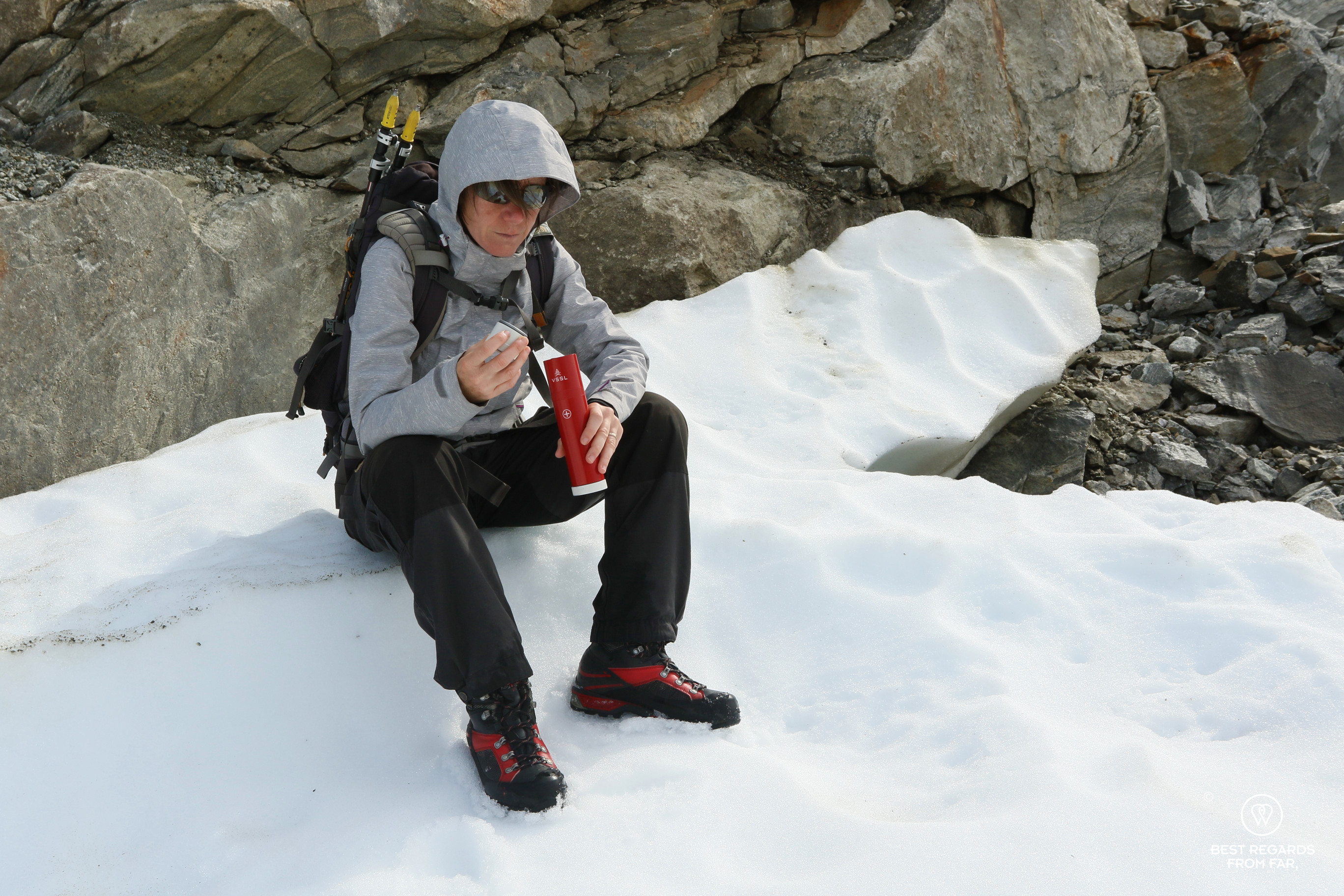 Checking the first aid gear before hiking on the glacier