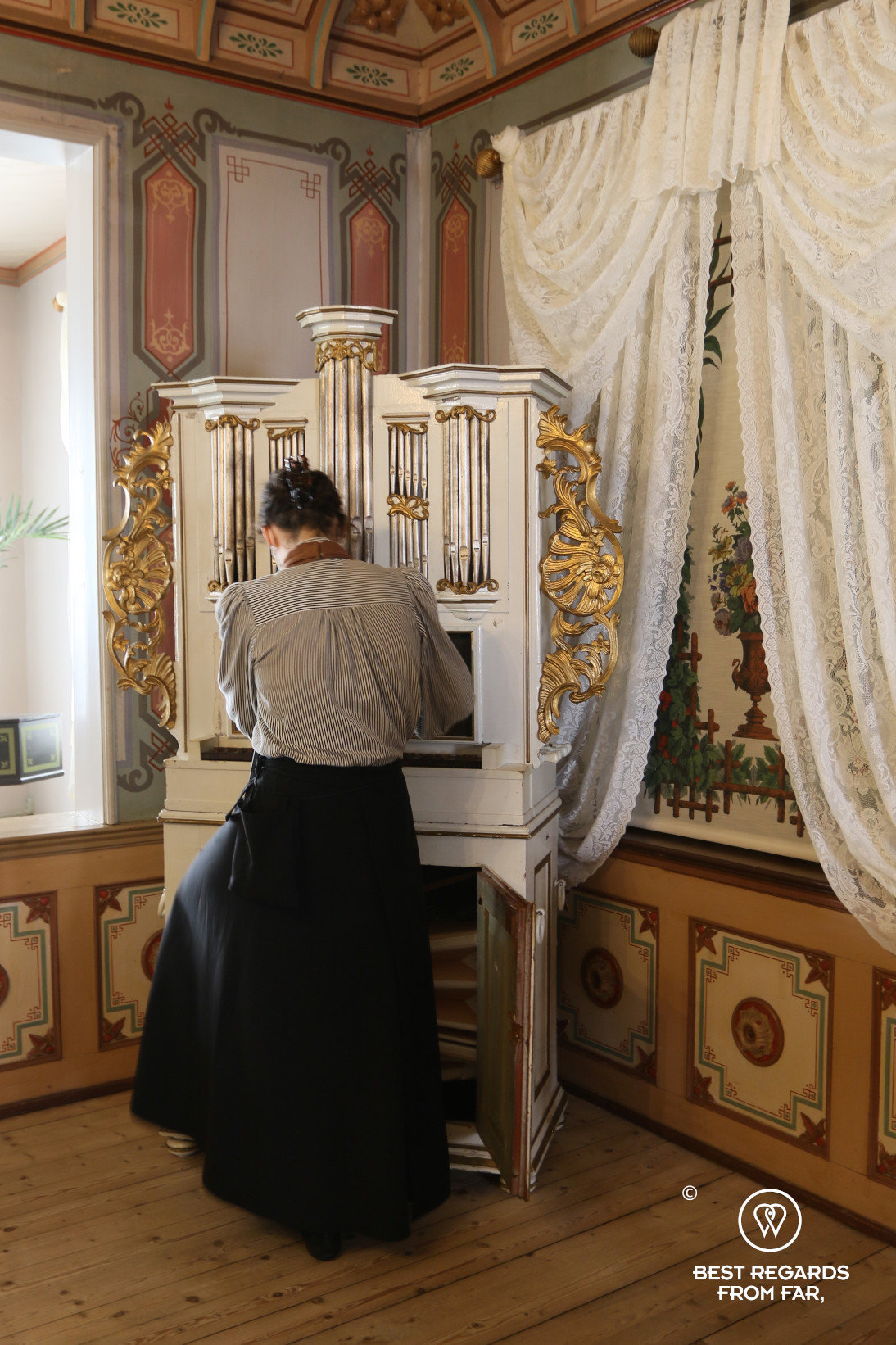 Guide in costume playing music at the Ringve Music Museum, Trondheim, Norway
