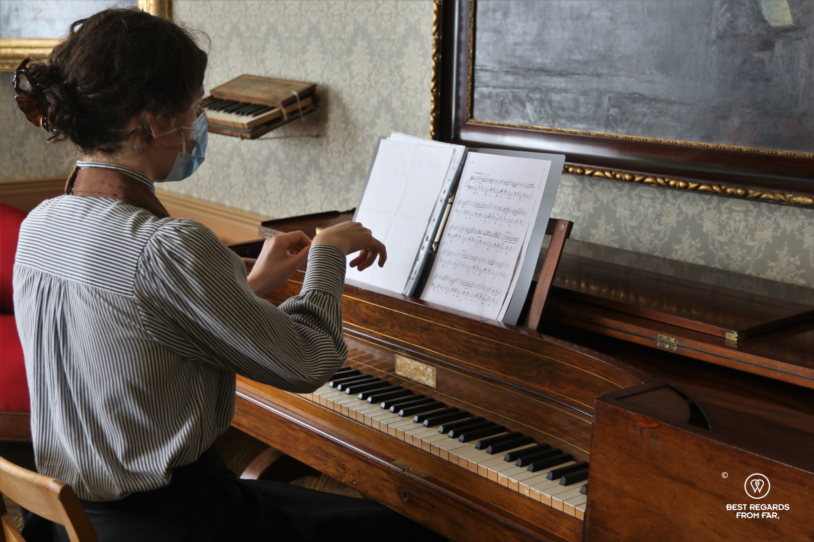 Guide in costume playing music at the Ringve Music Museum, Trondheim, Norway
