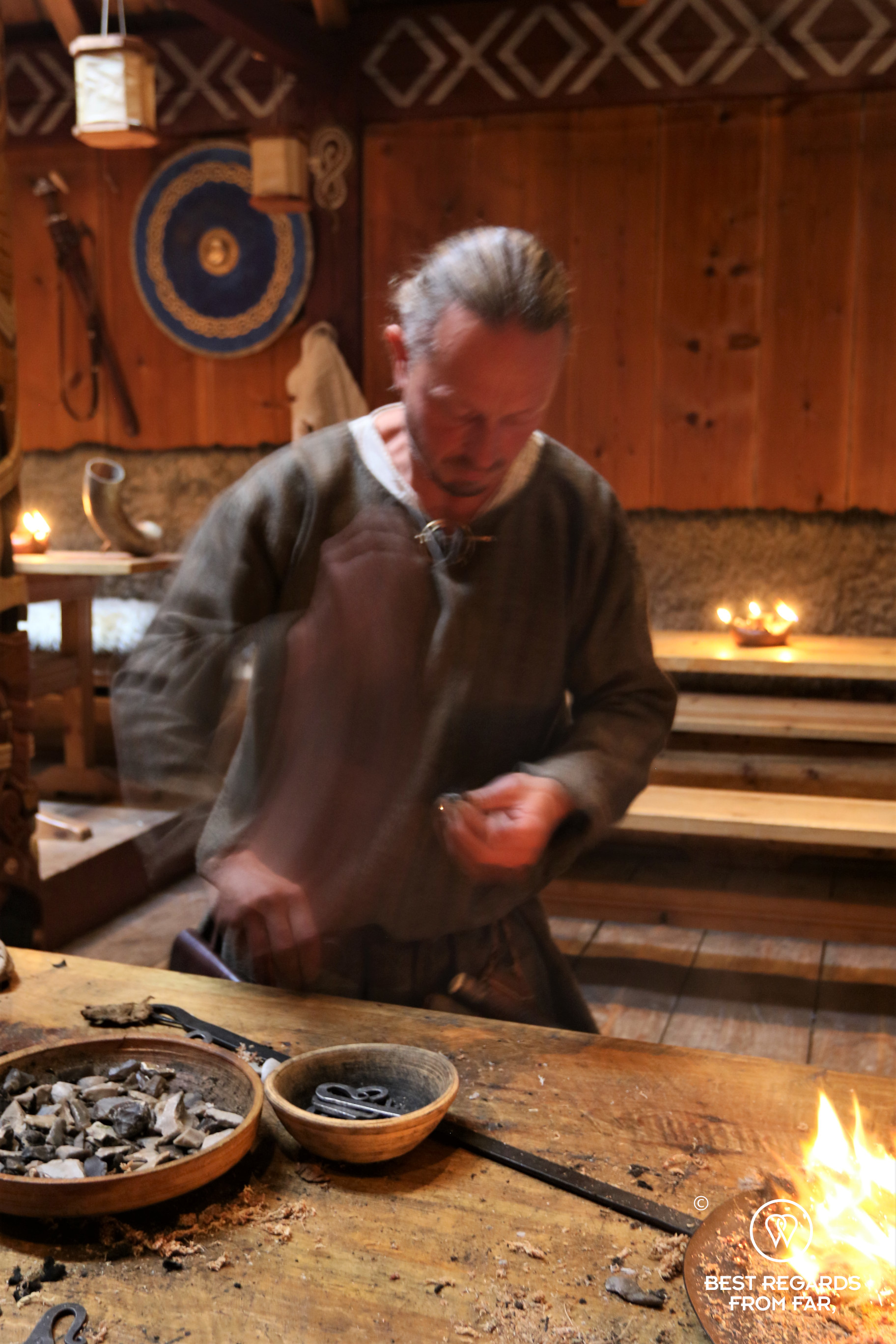 Archaeologist Per Steinar Brevik making fire at the Viking summer in Stiklestad, Norway