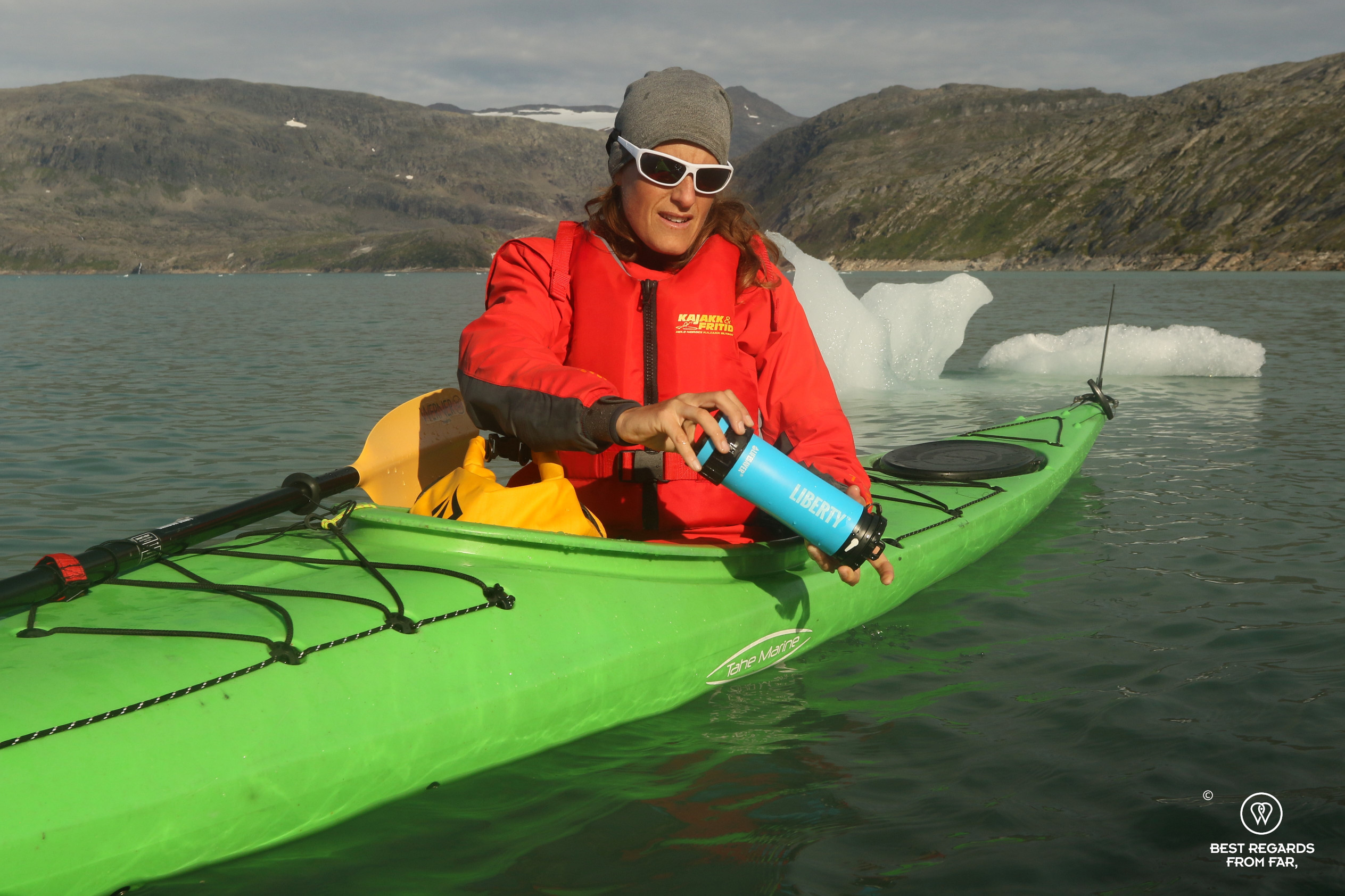 Filtering water while kayaking on an Arctic lake