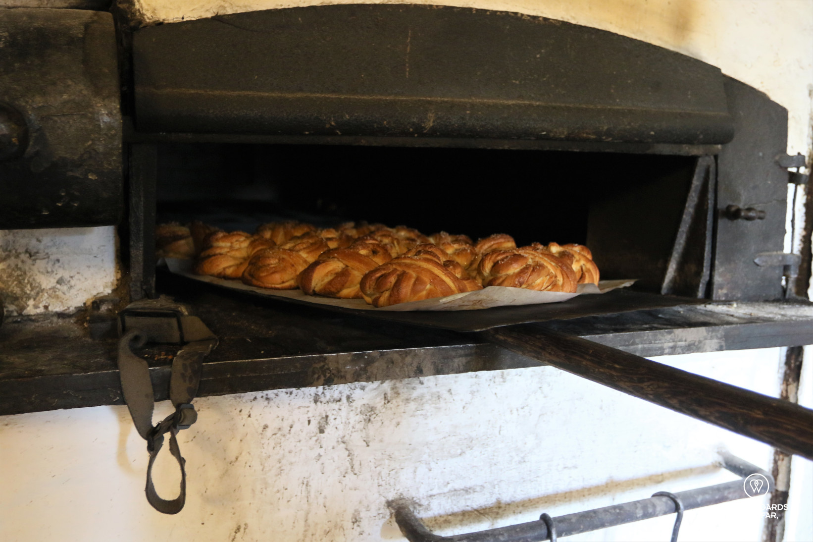 Baking cinnamon rolls in Å fishing village museum, Lofoten, Norway