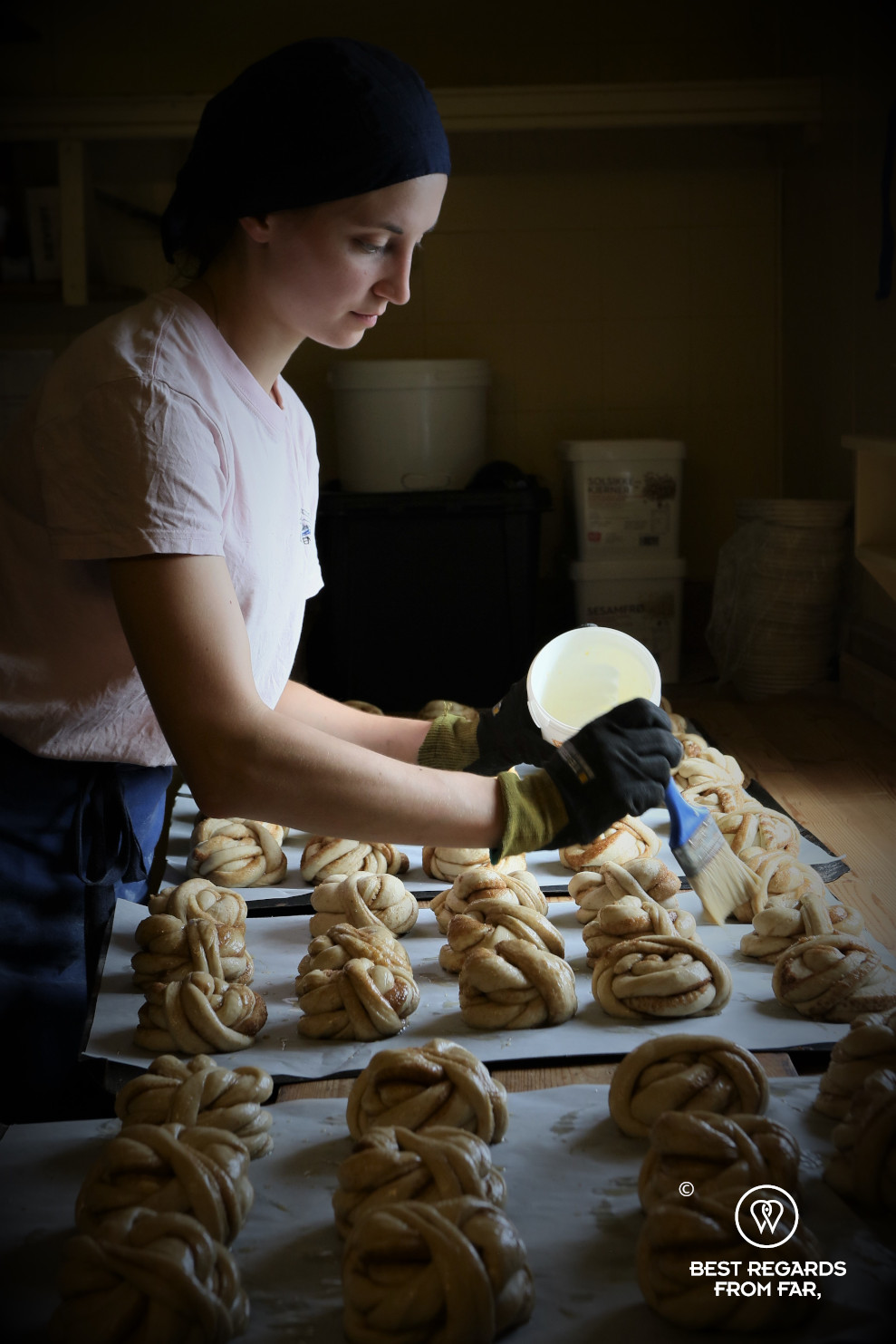 Baking cinnamon rolls in Å fishing village museum, Lofoten, Norway