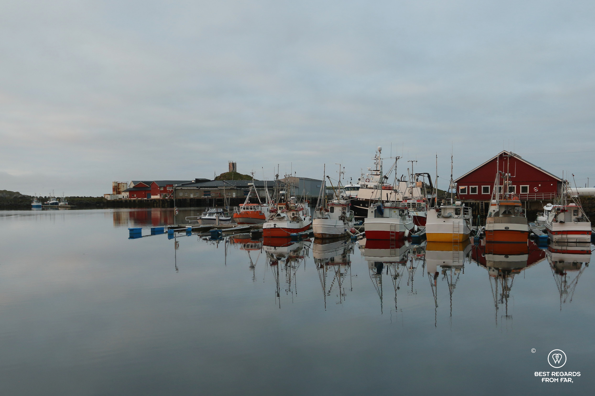 Colourful traditional fishing boats in Stø harbour, Norway