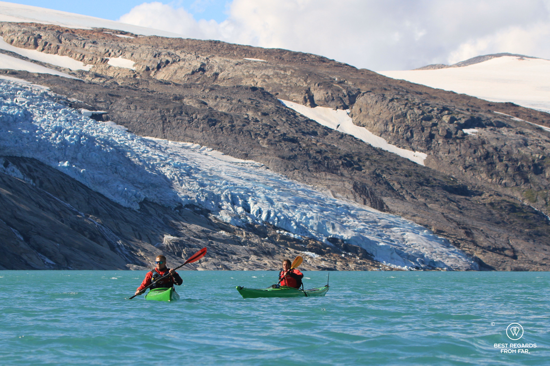 Author Claire Lessiau kayaking the arctic Storglomvatnet Lake