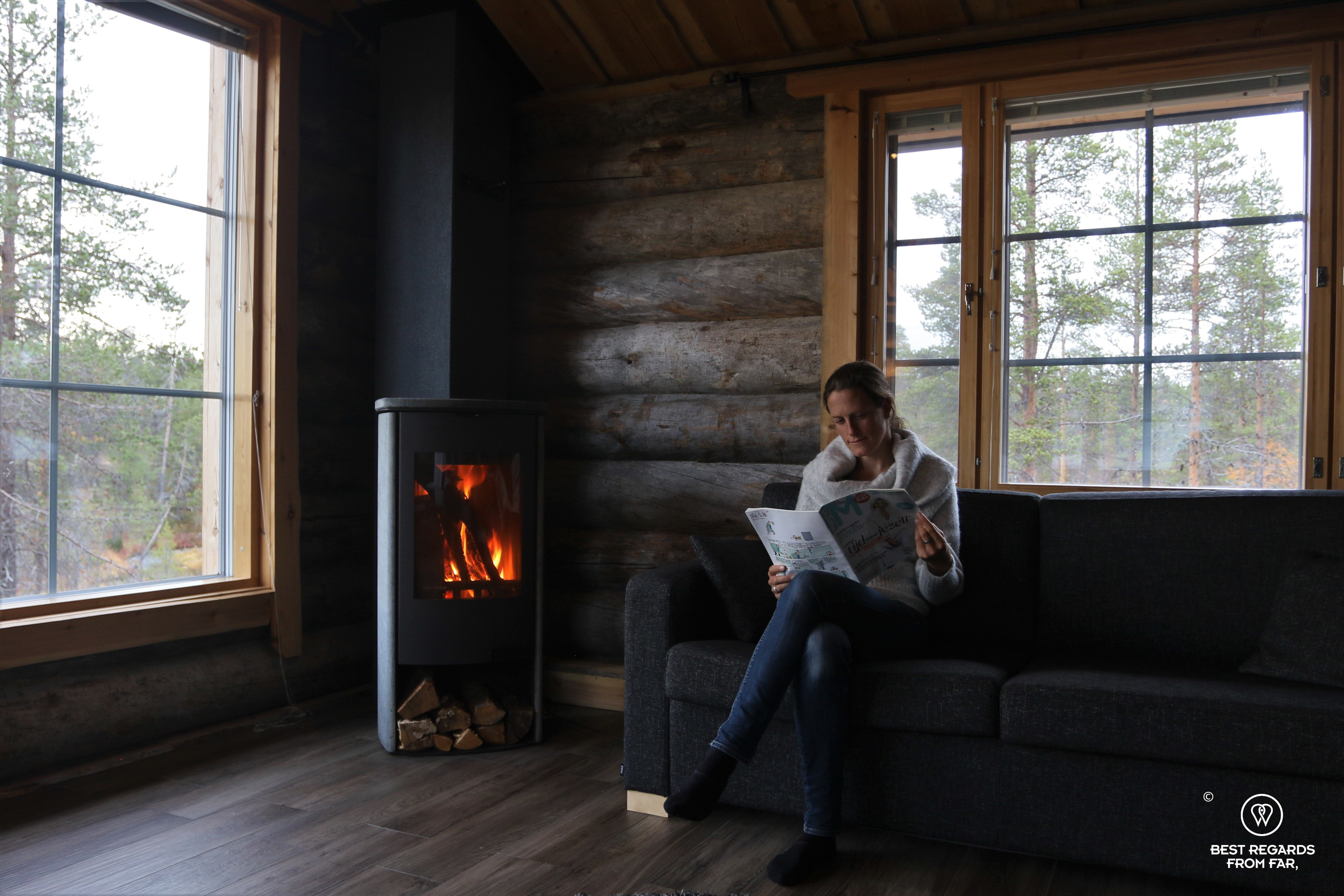 Resting by the fireplace at the Wilderness Muotka Nellim, Lapland