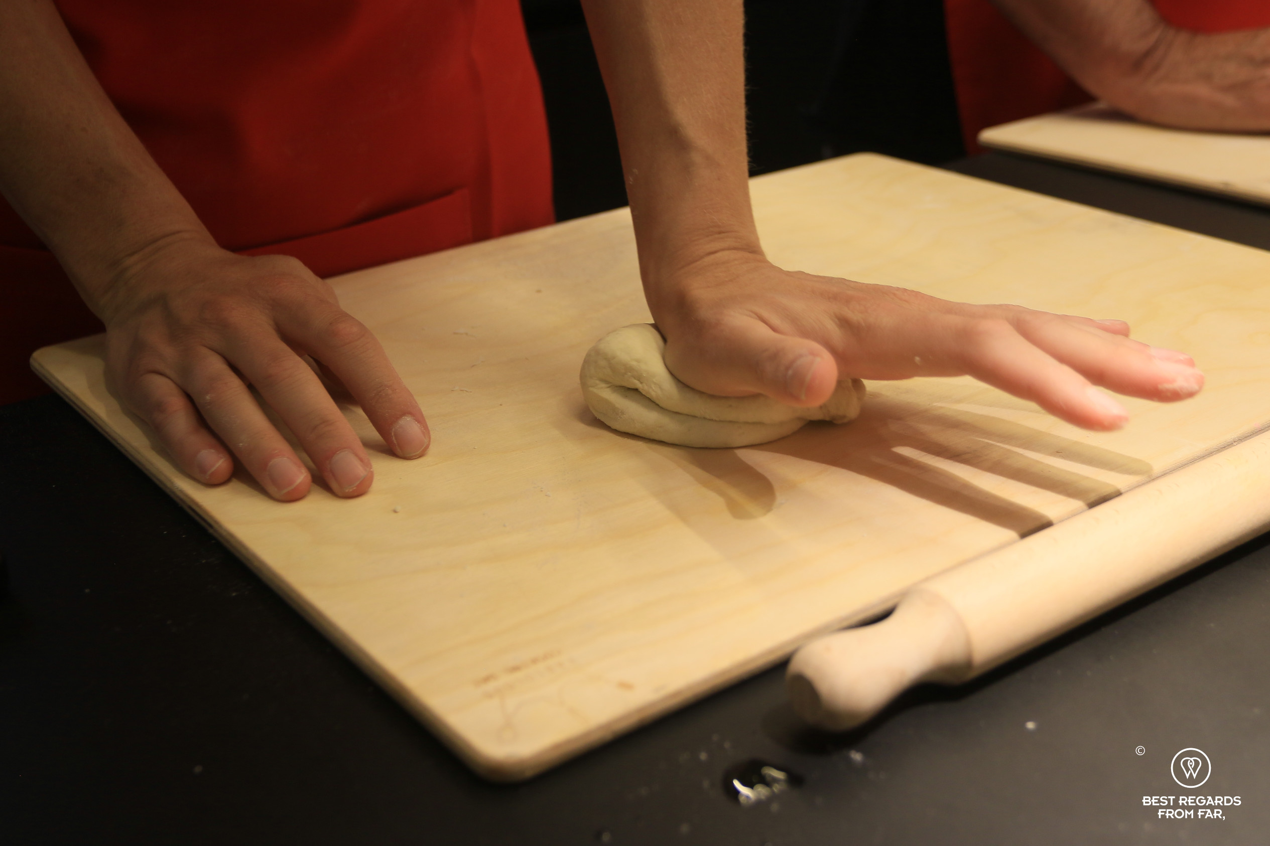 Kneading the pizza dough by hand