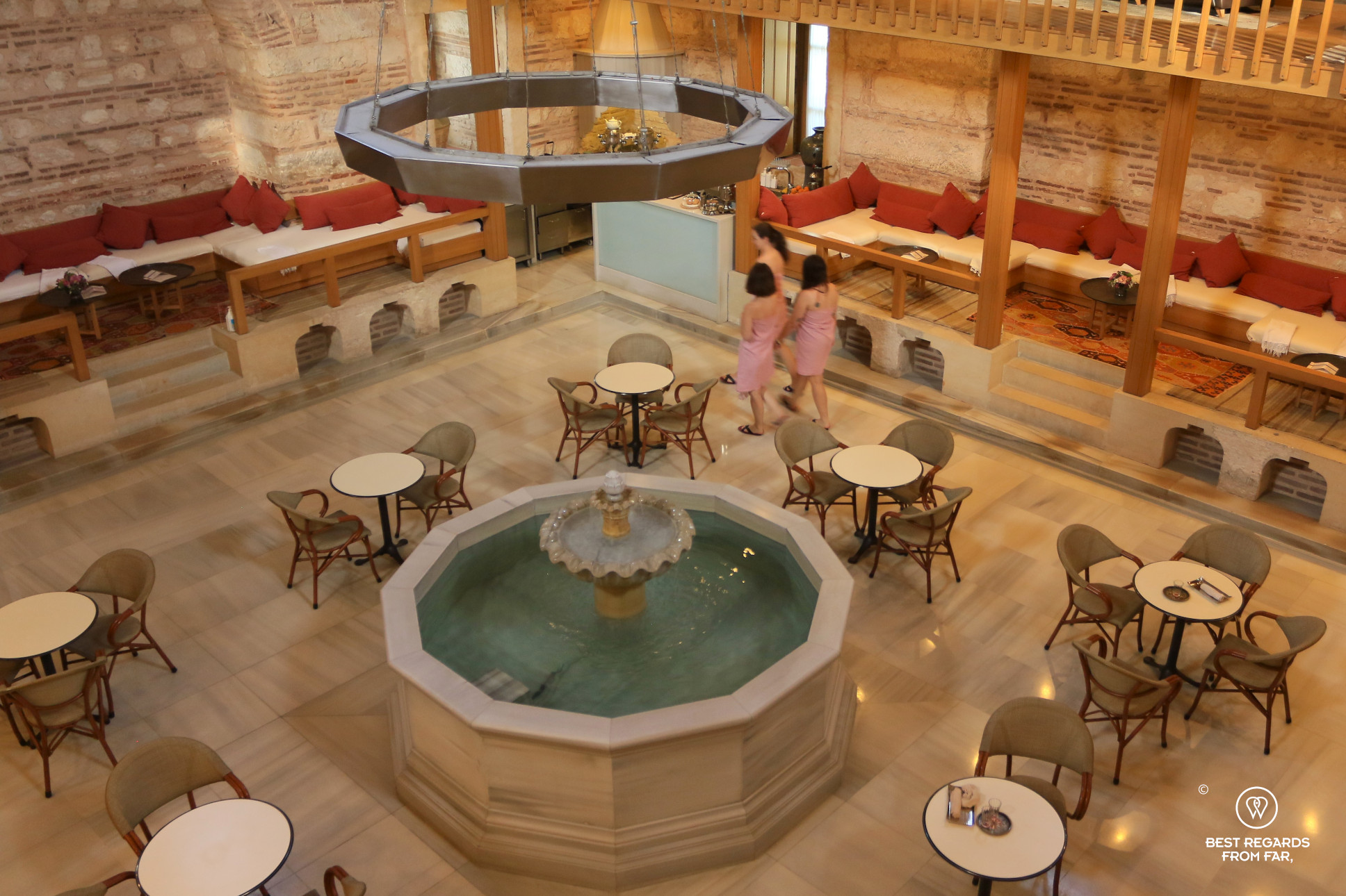 Women walking by the fountain of the Kiliç Ali Pasa Hammam, Istanbul
