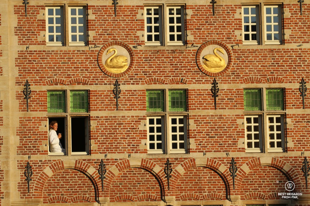 Woman at the window of the perfectly located Marriott Hotel in Ghent