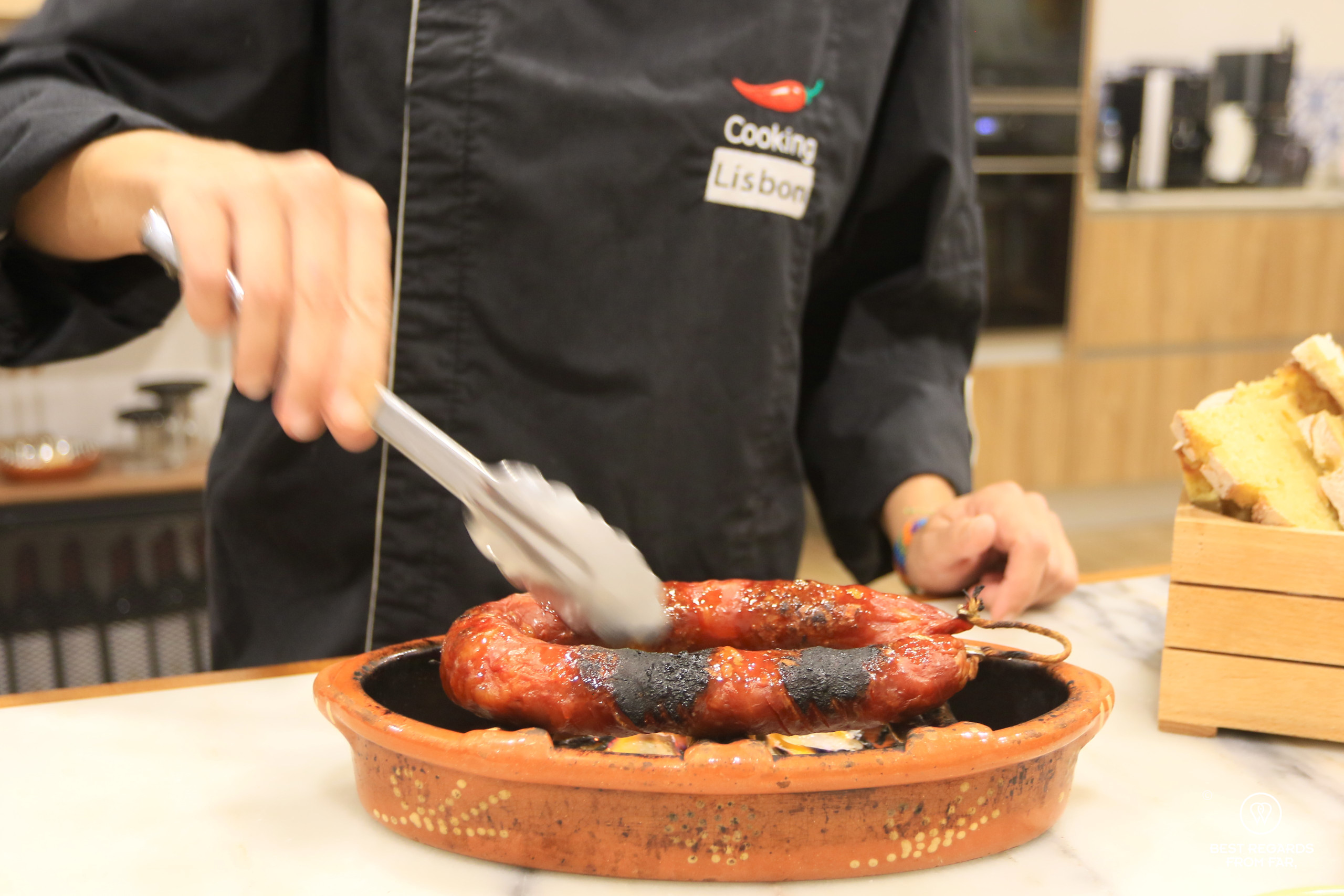 Chef Sara grilling a traditional chorizo, Cooking Lisbon