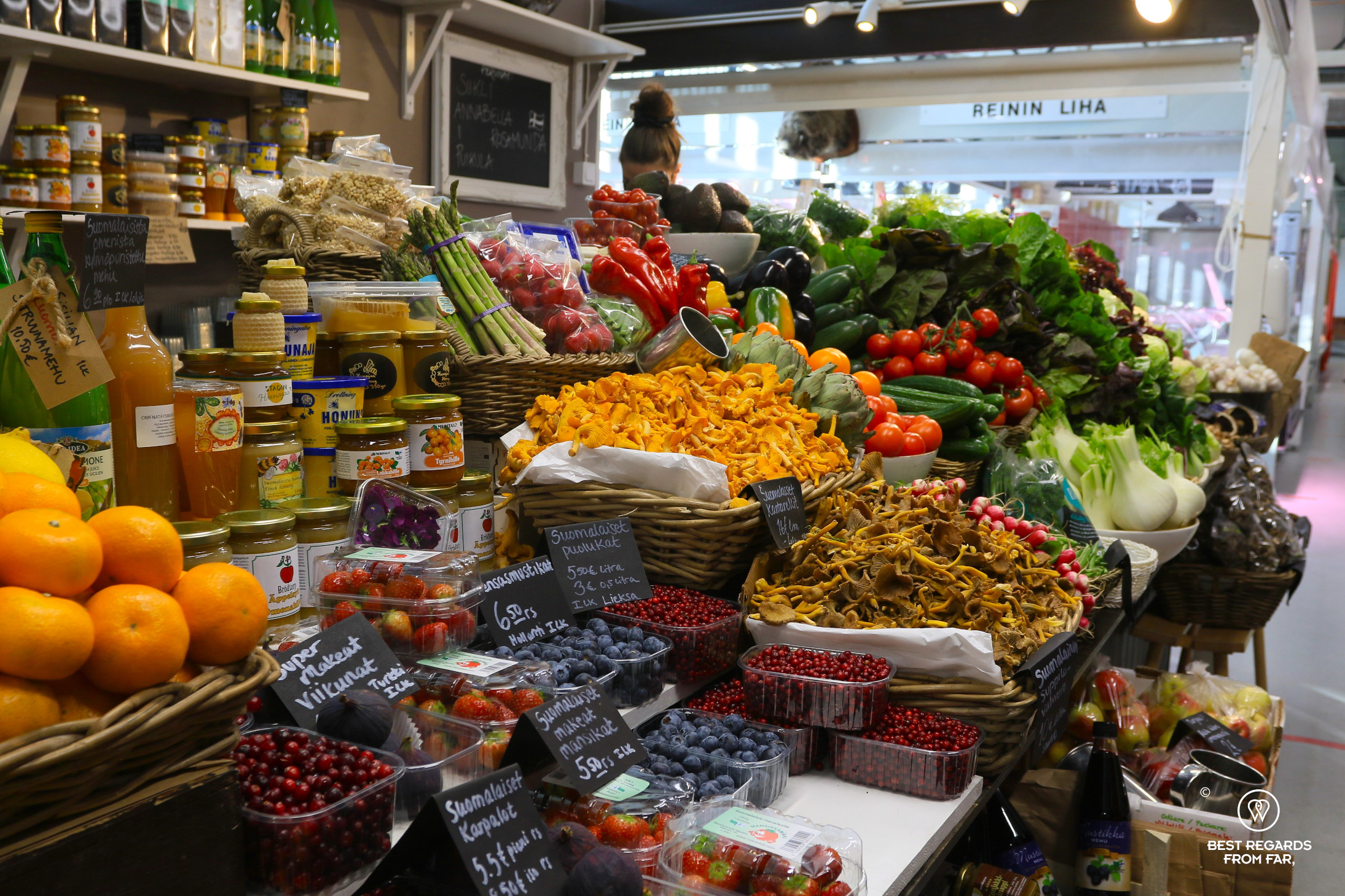 Colourful seasonal fruits and vegetables at the Hakaniemi market hall, Helsinki