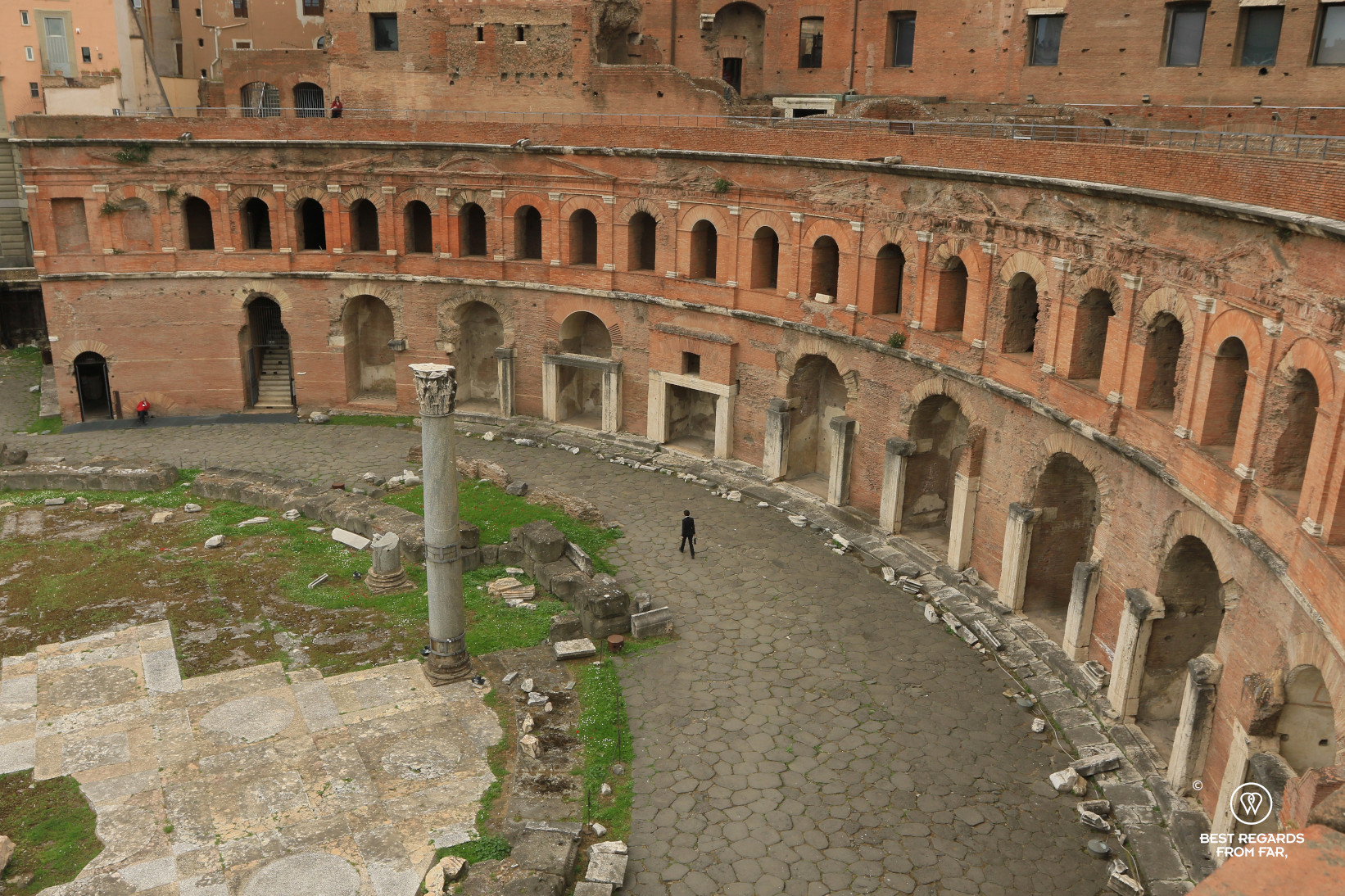 Person walking along Trajan's Market, Rome, Italy