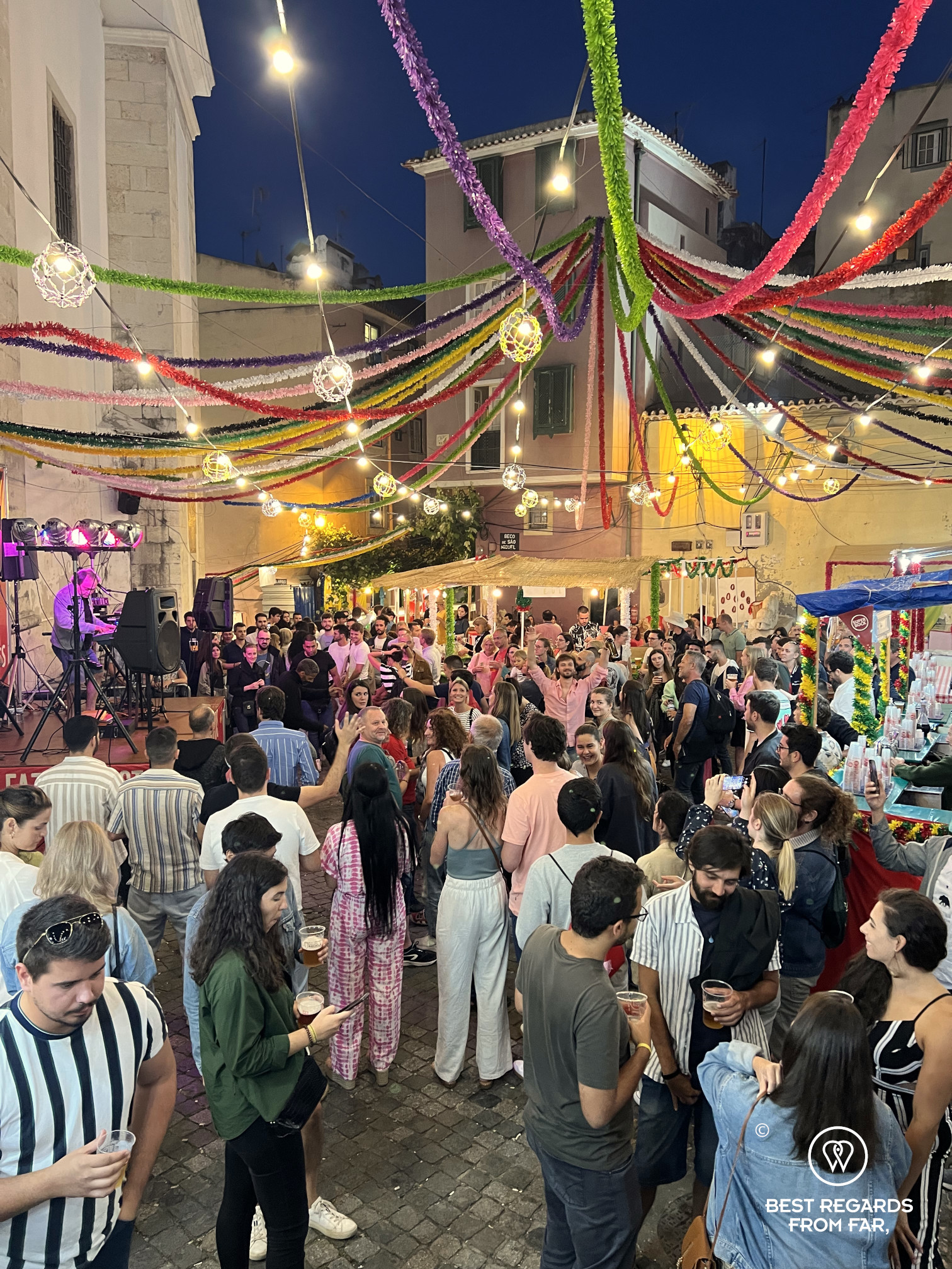 People having drinks in the streets of Alfama in Lisbon