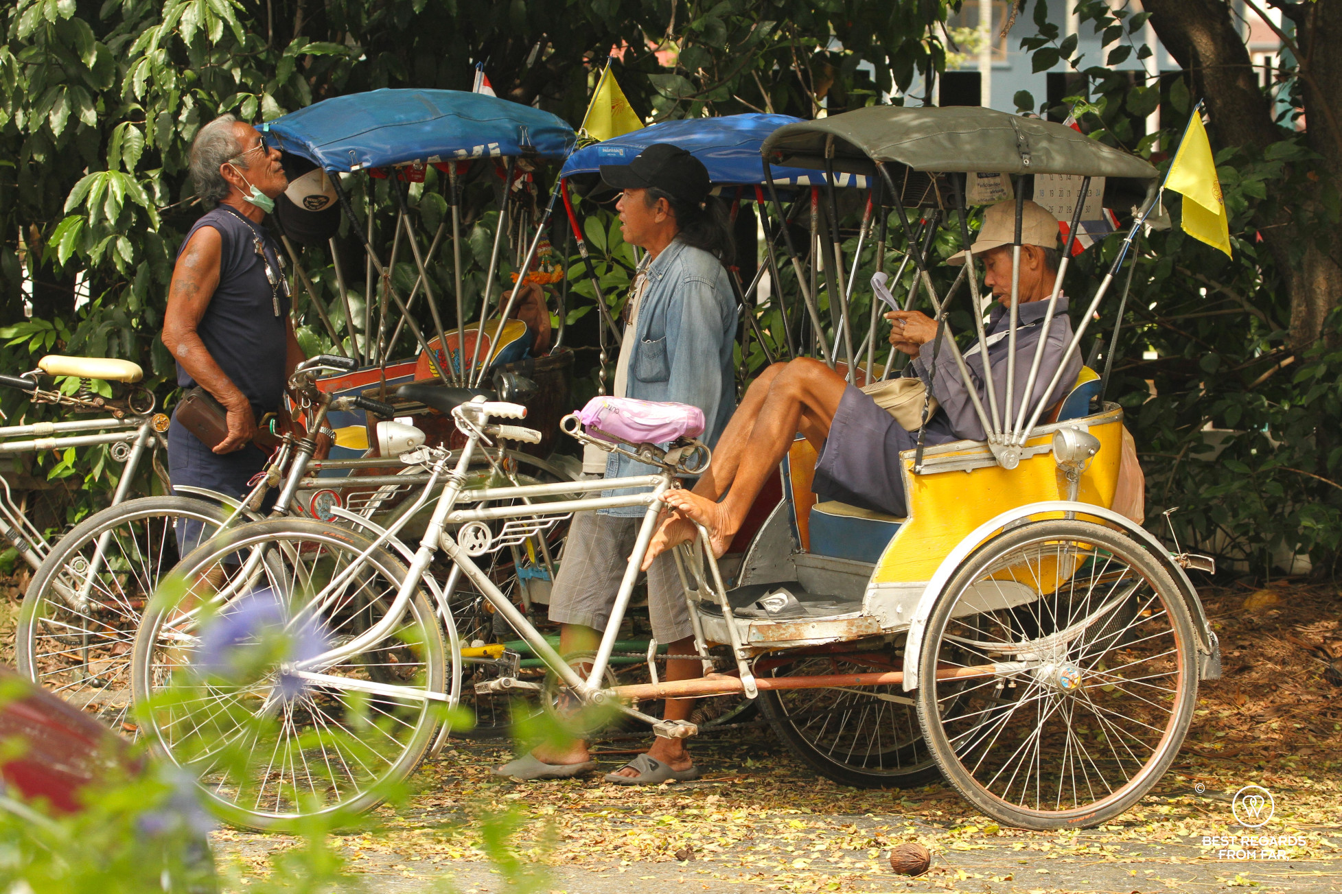 Samlor drivers joking in Chiang Mai, Thailand