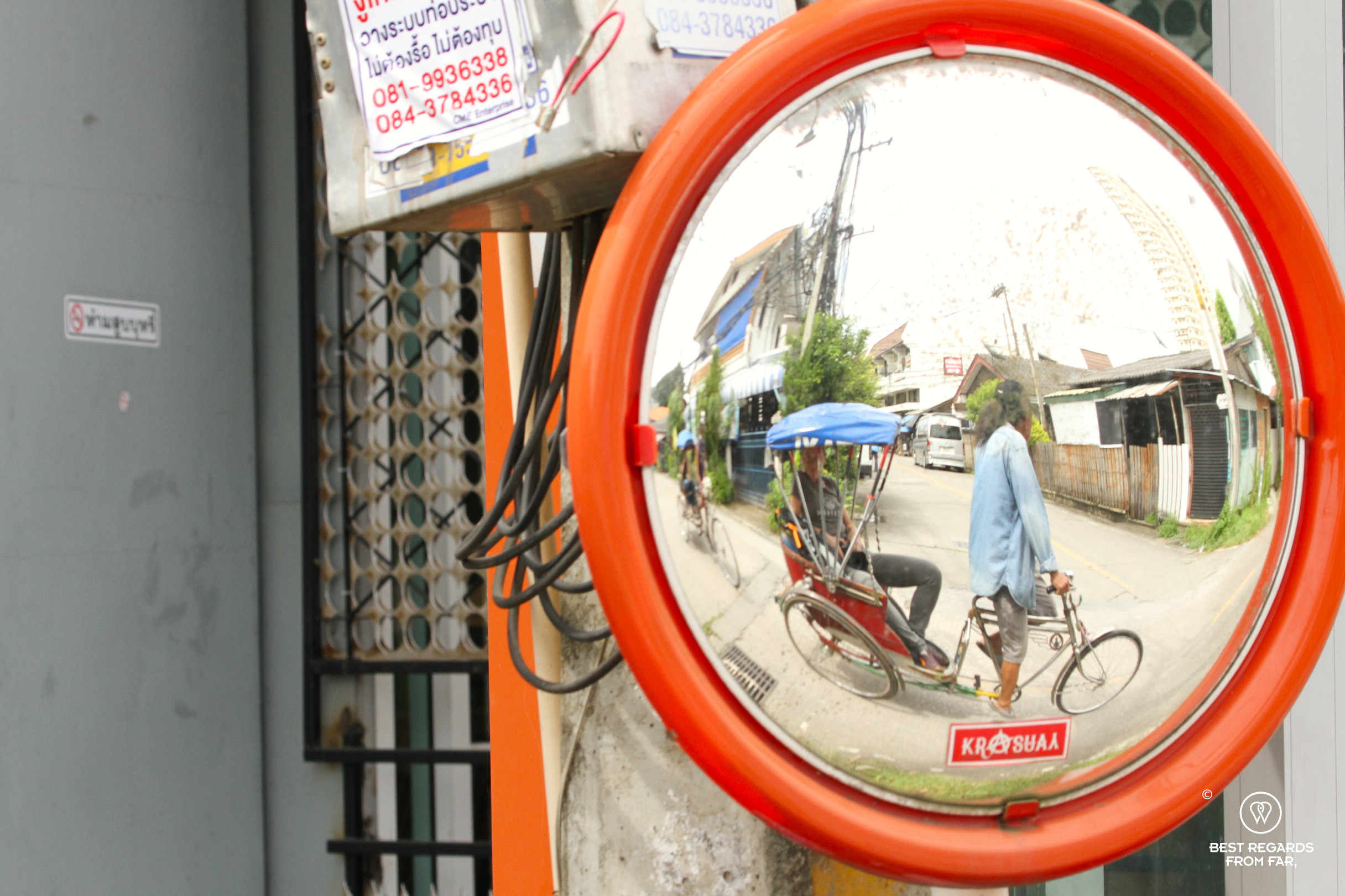 Reflection of trishaw in a mirror in Chiang Mai