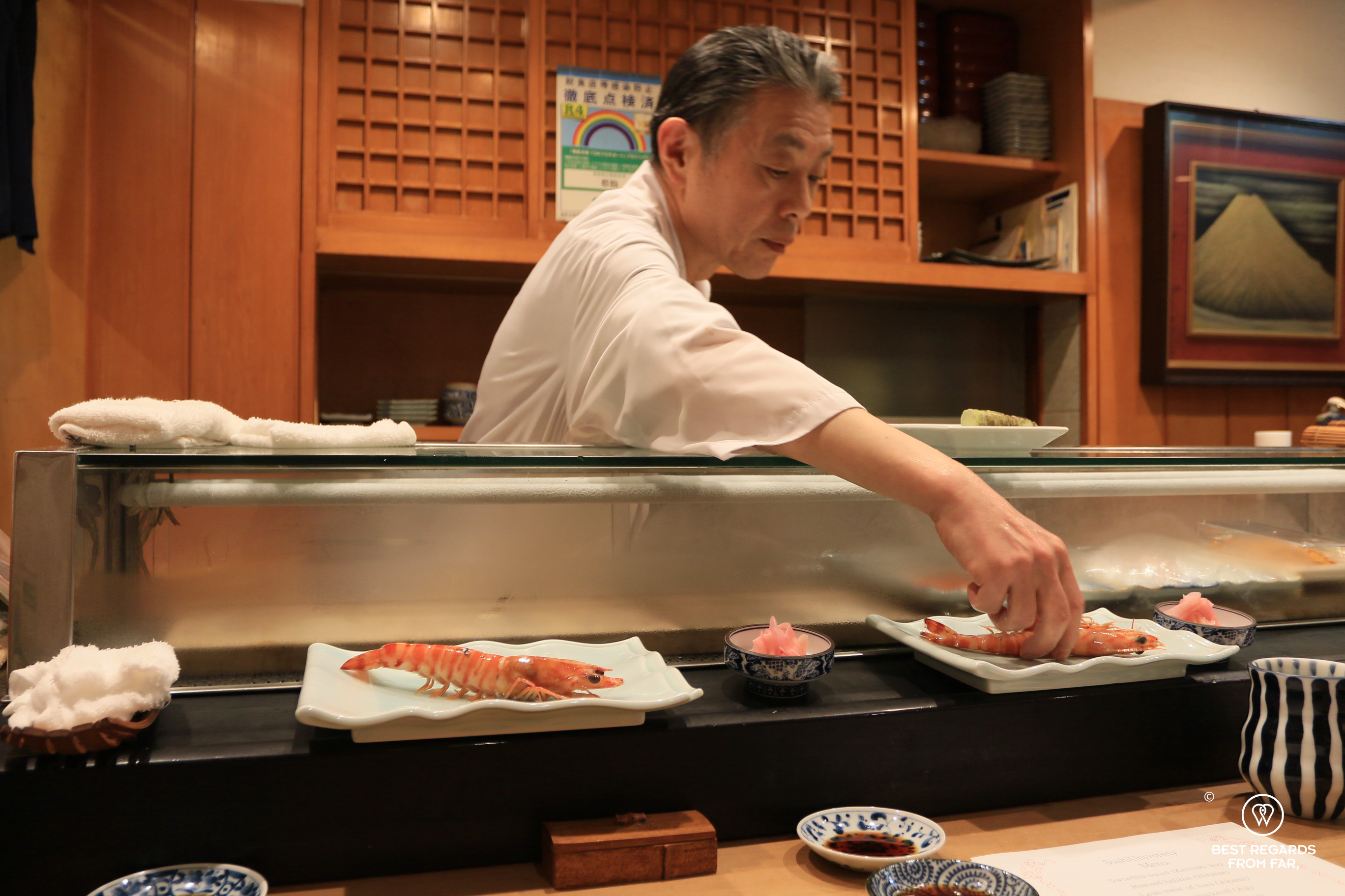 Sushi chef presenting Kuruma prawn (Kuruma ebi), Tokyo