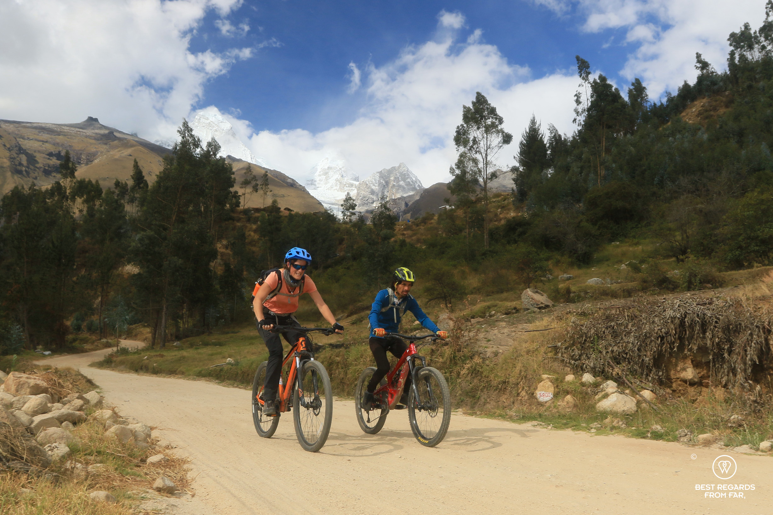 Man and woman mountain biking the Cordillera Blanca in Peru