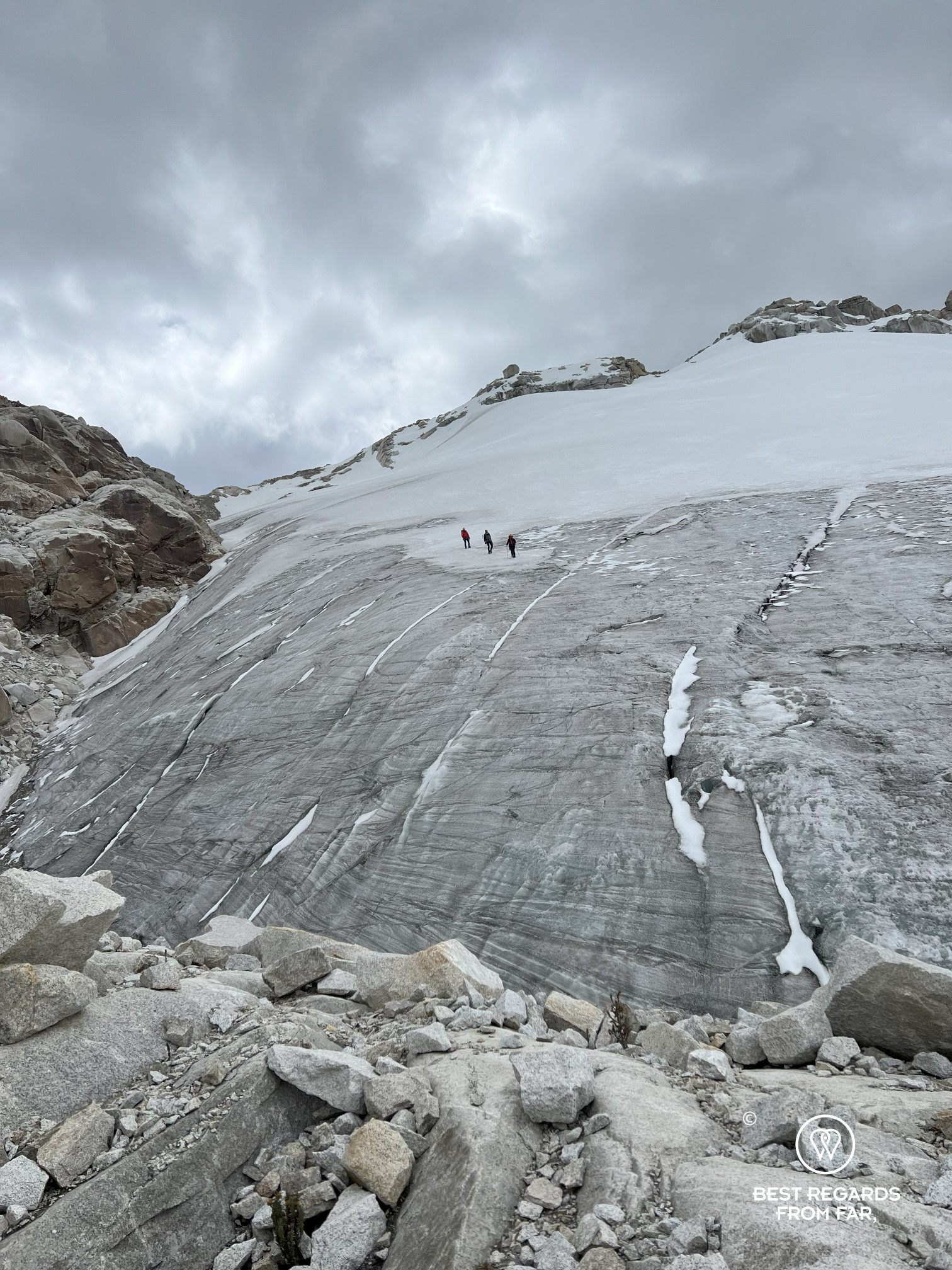 Three people crossing the glacier, trekking the Cordillera Blanca, Peru