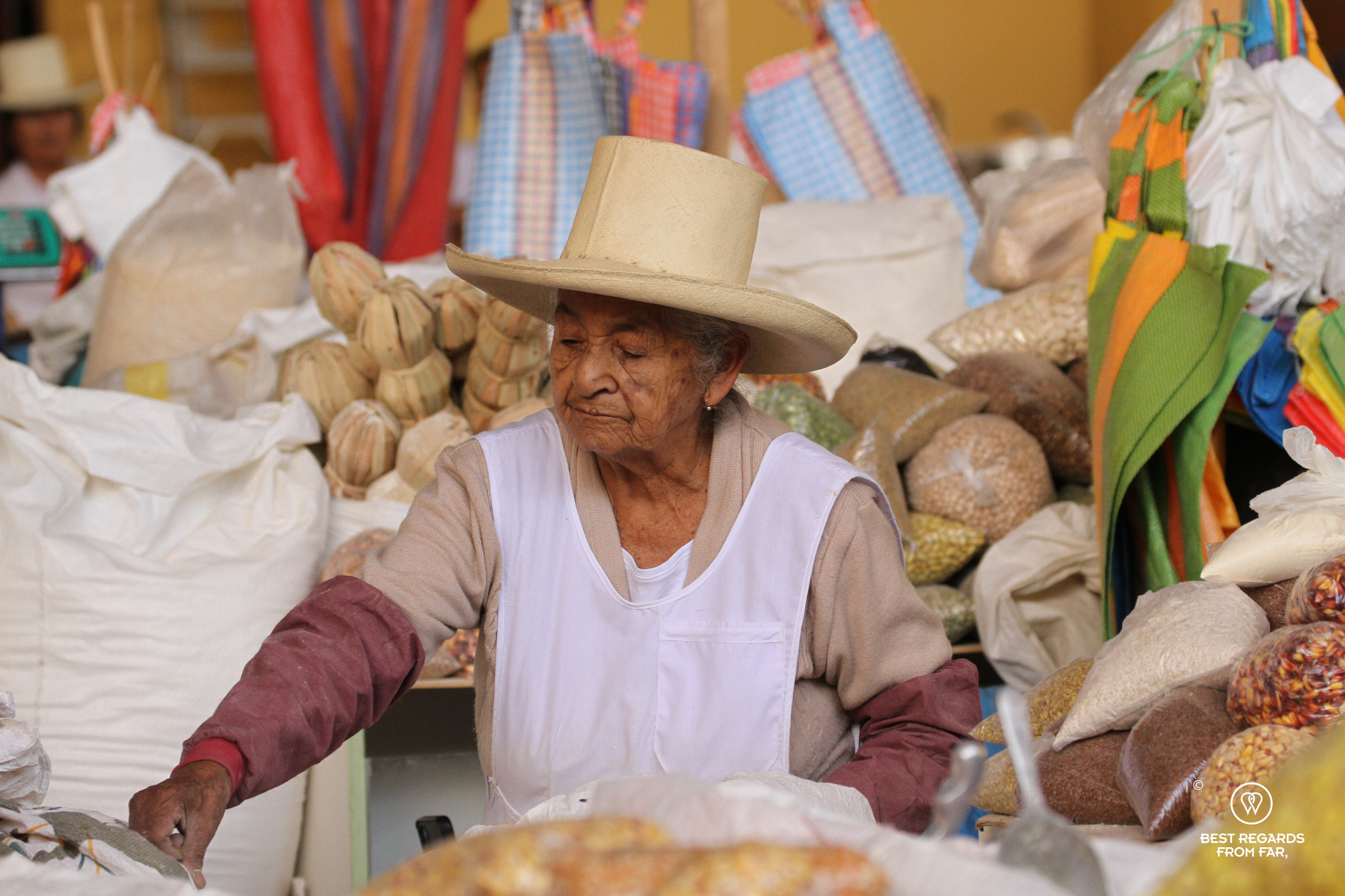 Woman selling local products at the Sunday market in Carhuaz, Peru