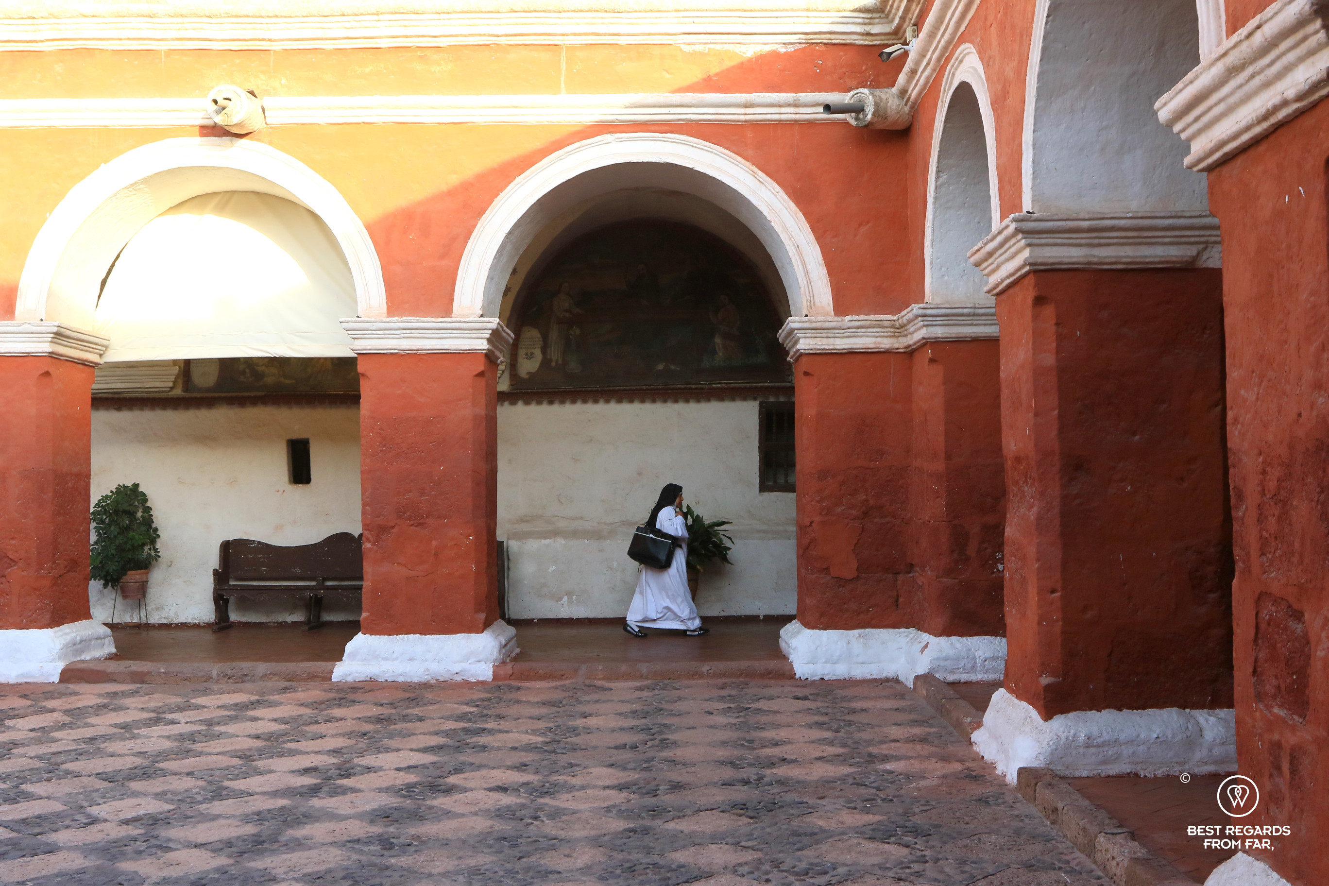 Nun walking in the main cloister of the Monastery of Santa Catalina, Arequipa