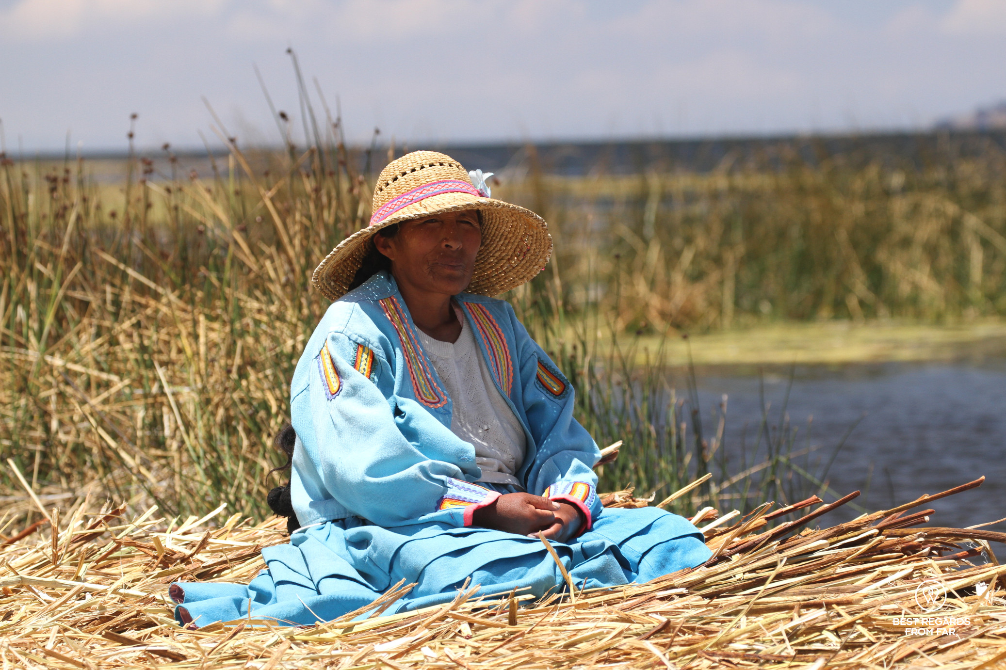 Woman in traditional cloths on Uros Titino floating island, Lake Titicaca