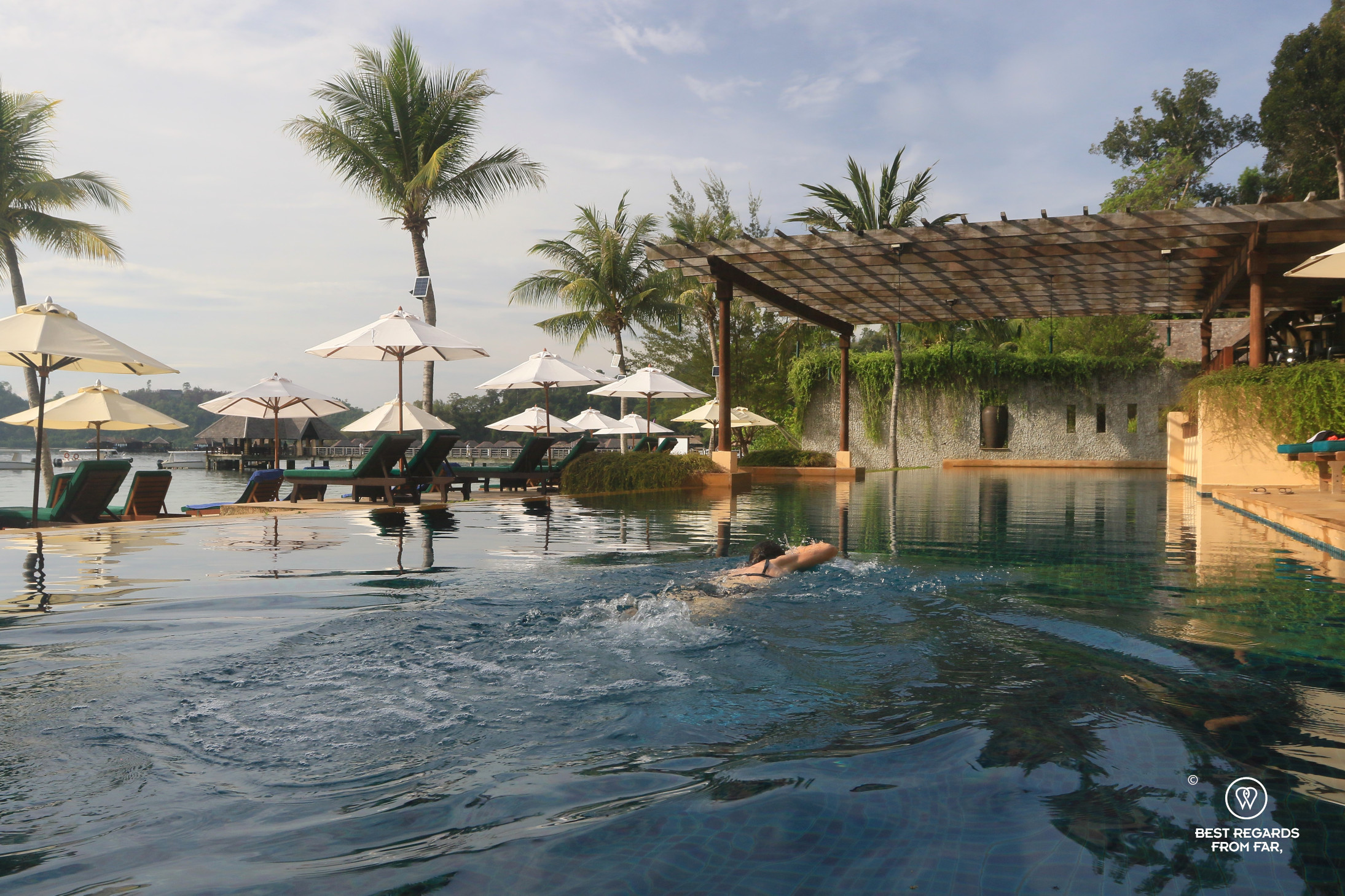 Author Claire Lessiau swimming in the early morning having the pool to herself at the Gaya Island Resort.