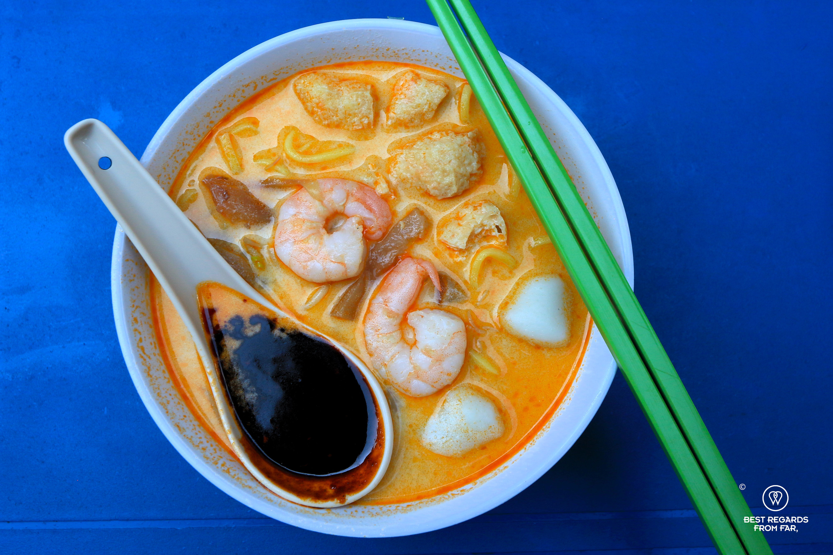Curry Mee with shrimps in a bowl.