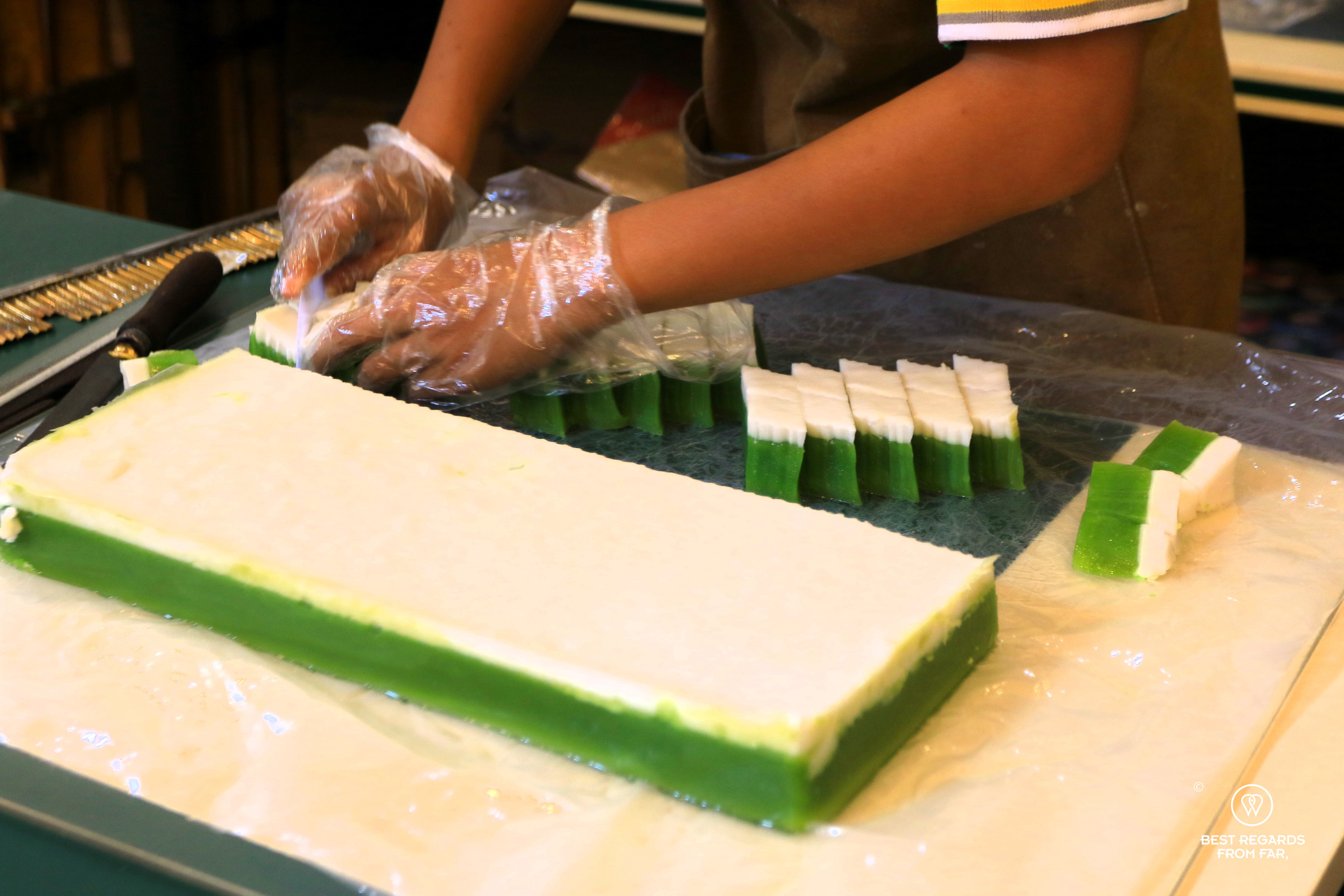 Woman making Kueh Talam Nyonya cuisine.