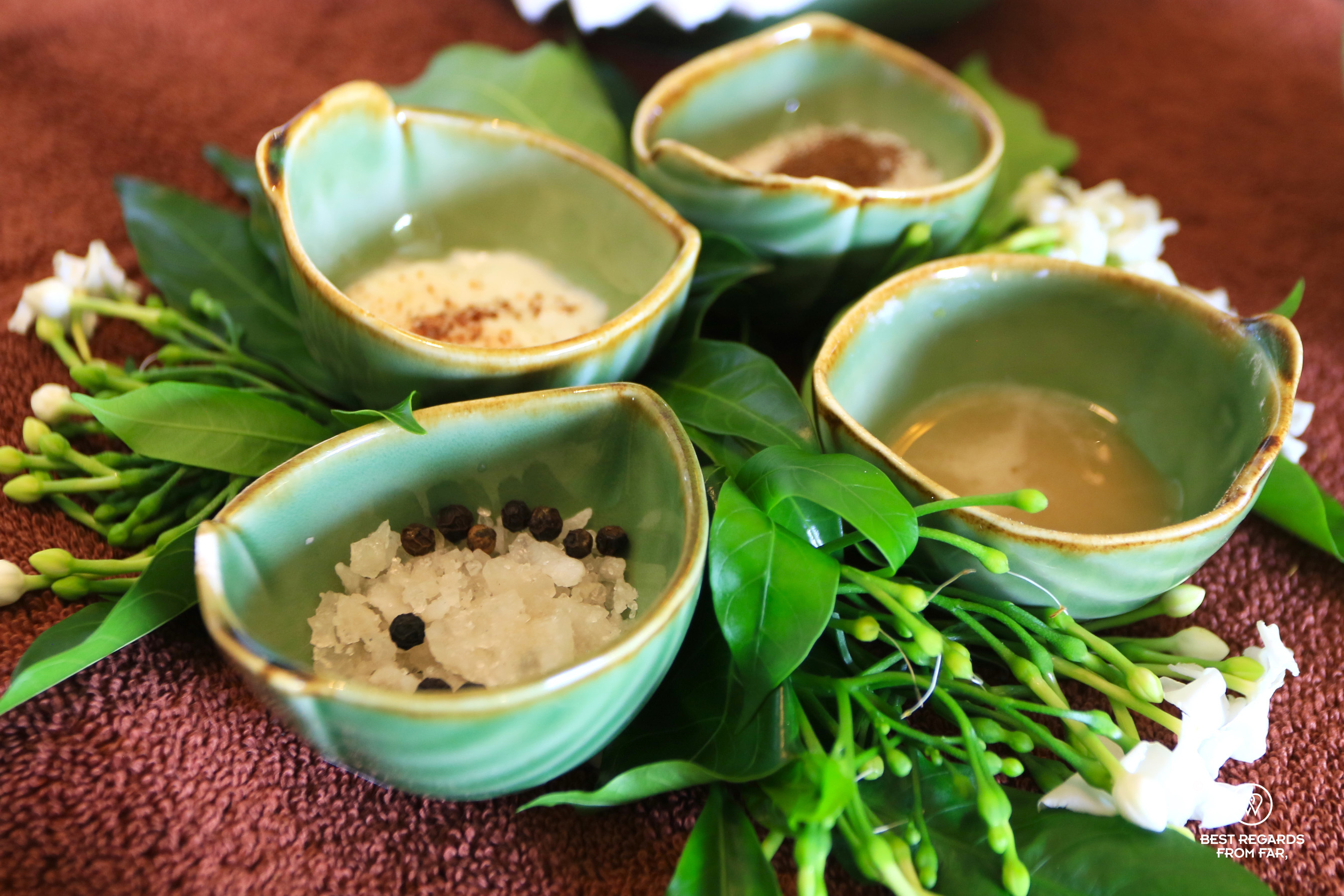 Four green bowls with natural ingredients for a spa treatment at the Gaya Island Resort, Borneo.