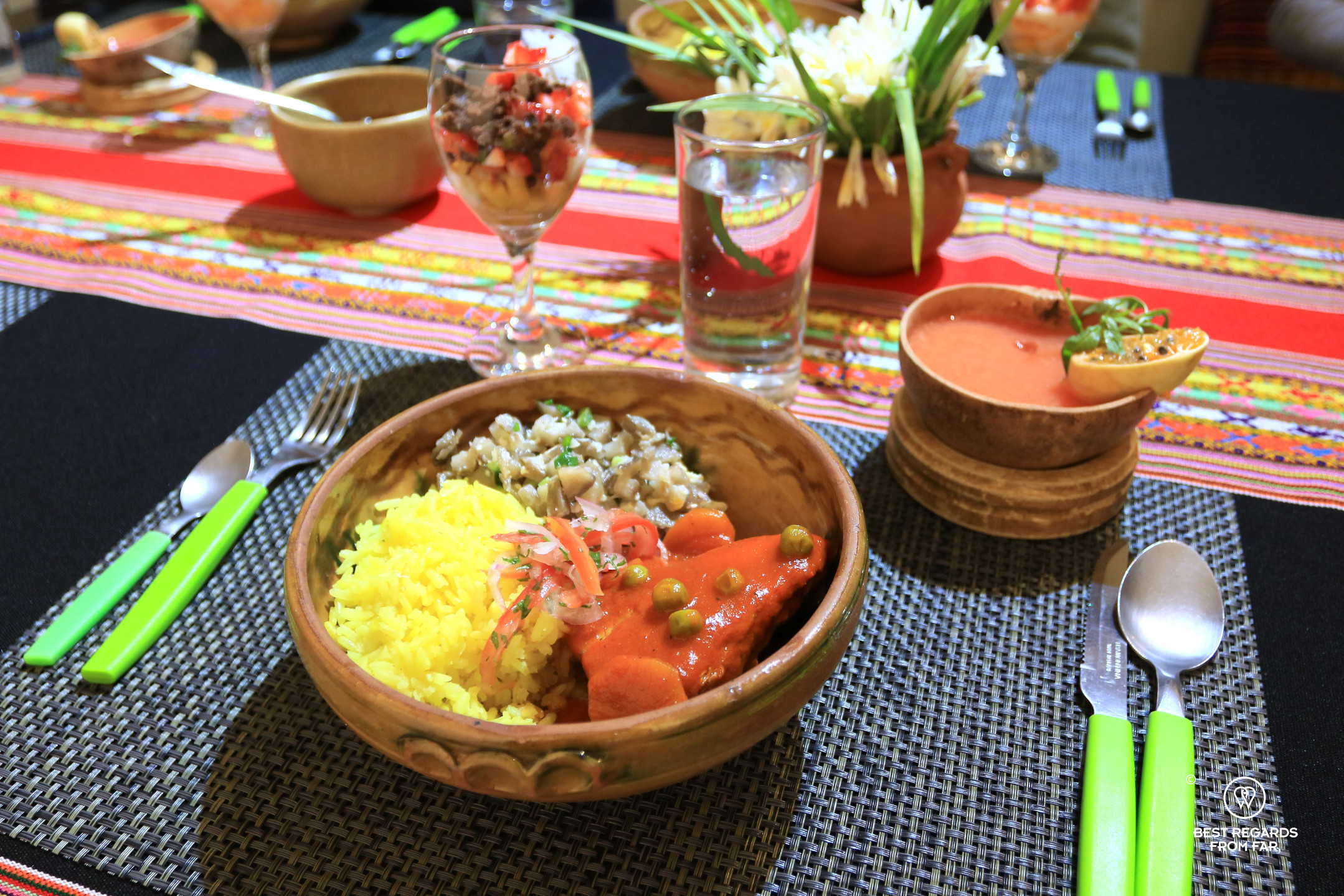 Pollo picante presented on a colorful table at La Boca del Sapo cooking class in Sucre.